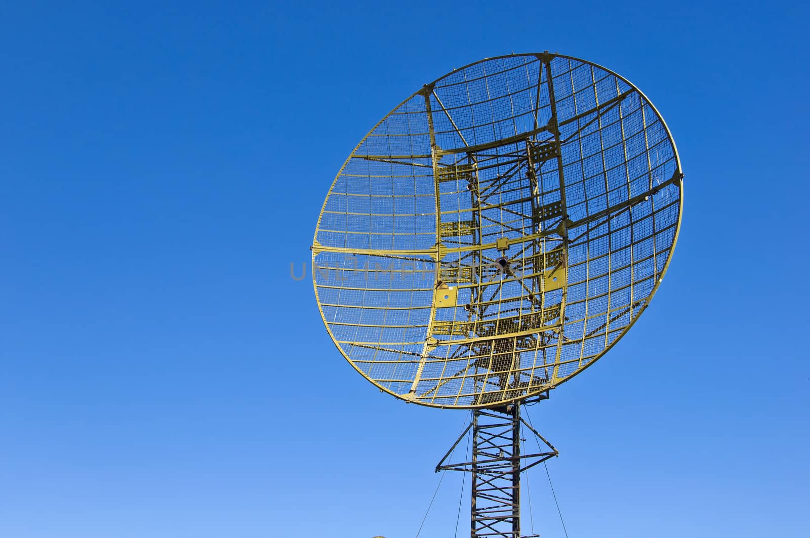 Military radar station against the clear blue sky