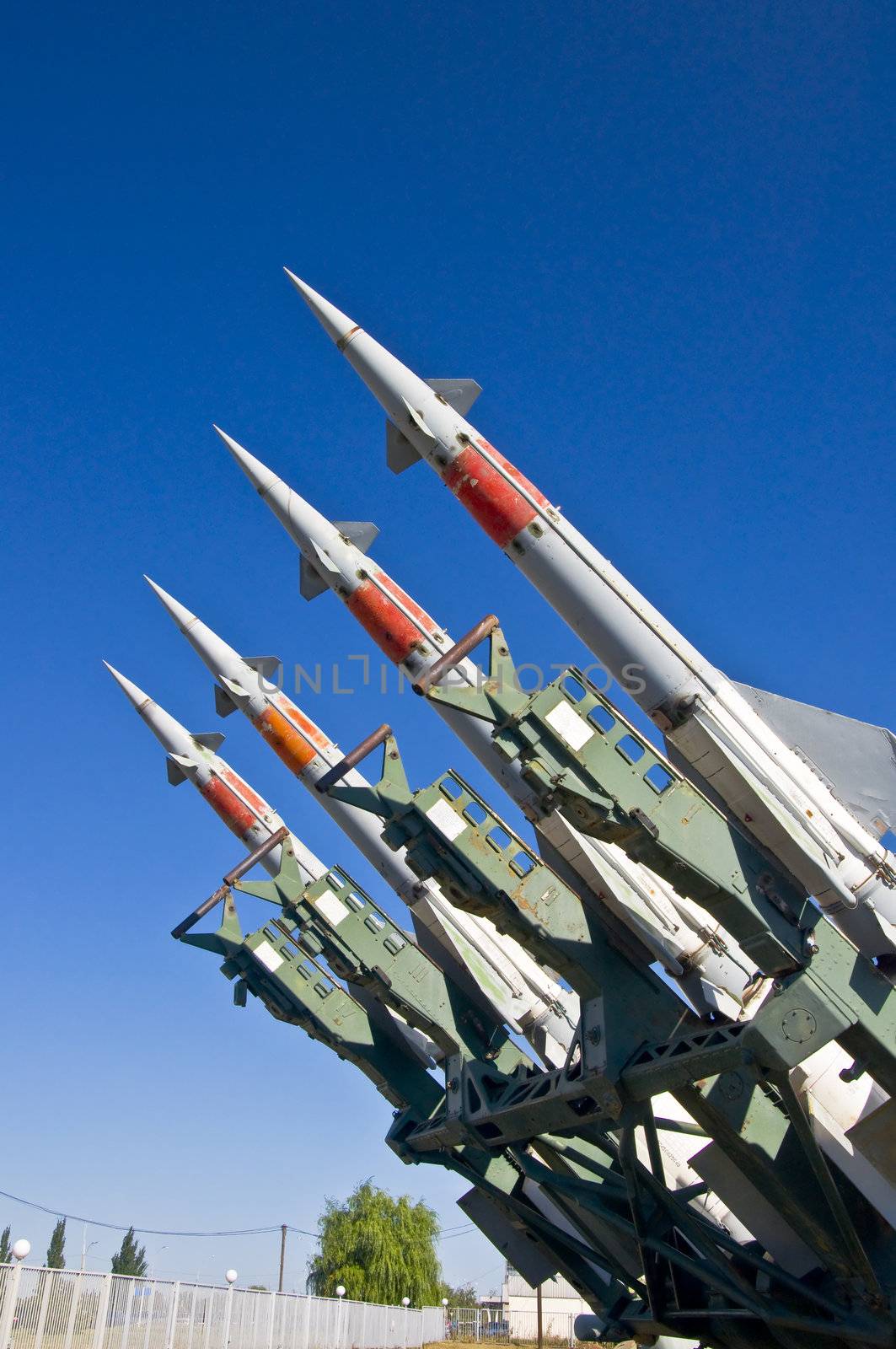 Antiaircraft rockets on the launcher against blue sky.