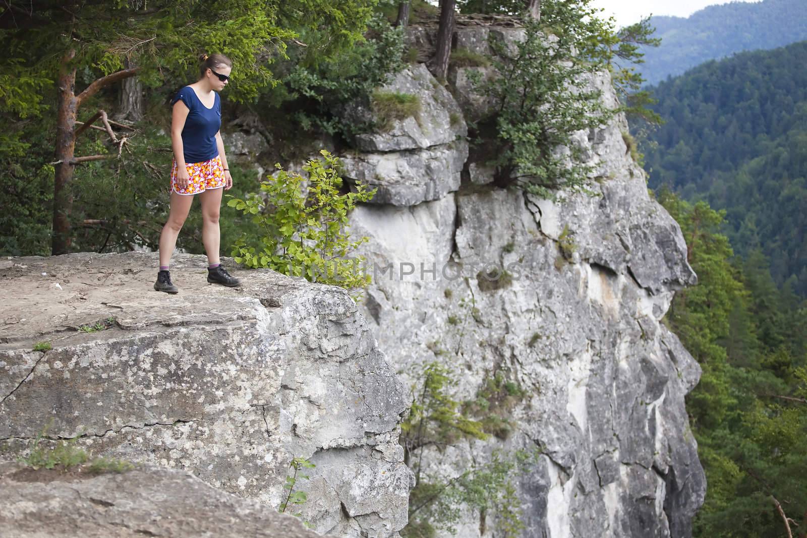 woman standing on big rock by furzyk73