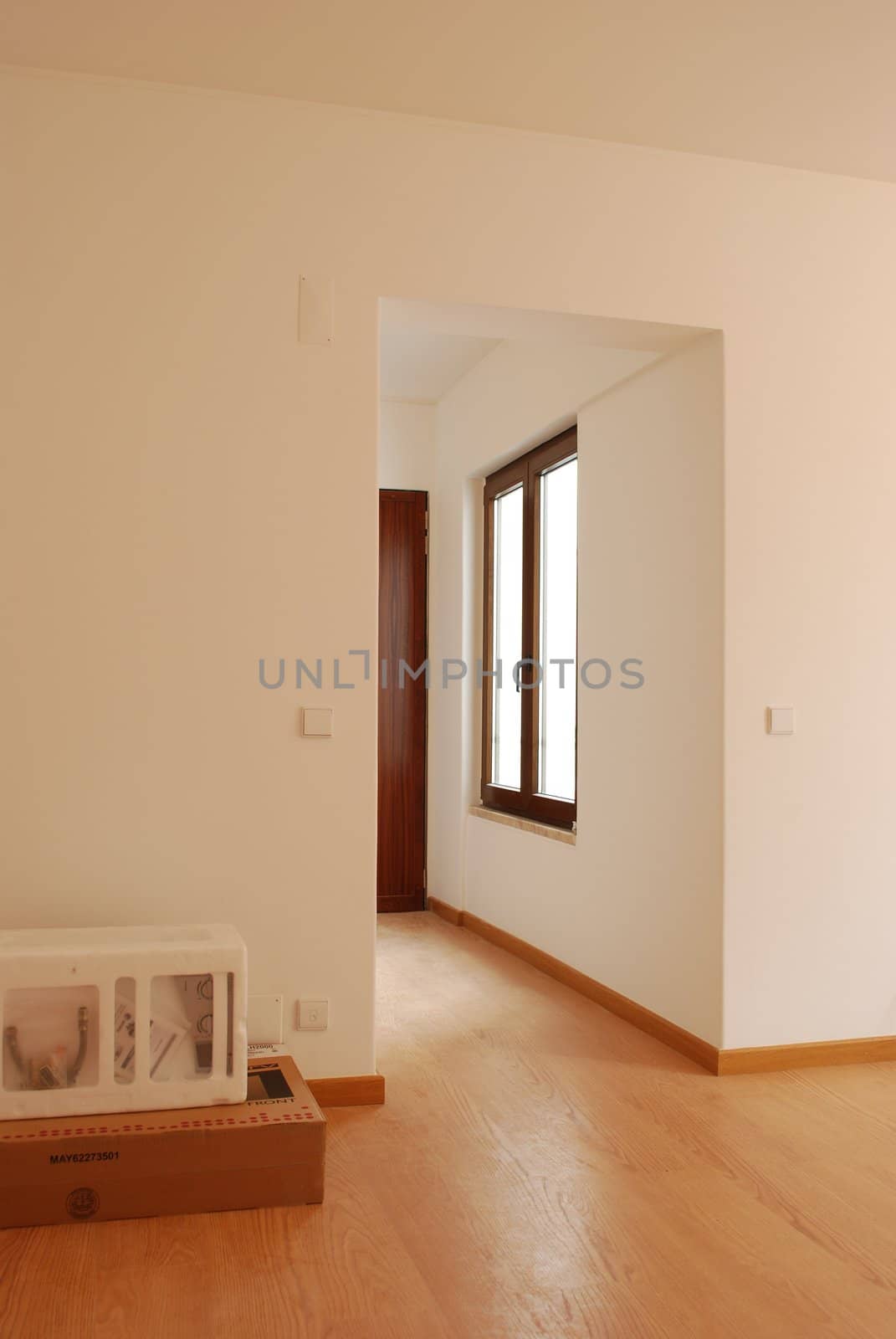 empty living room with window and wooden floor