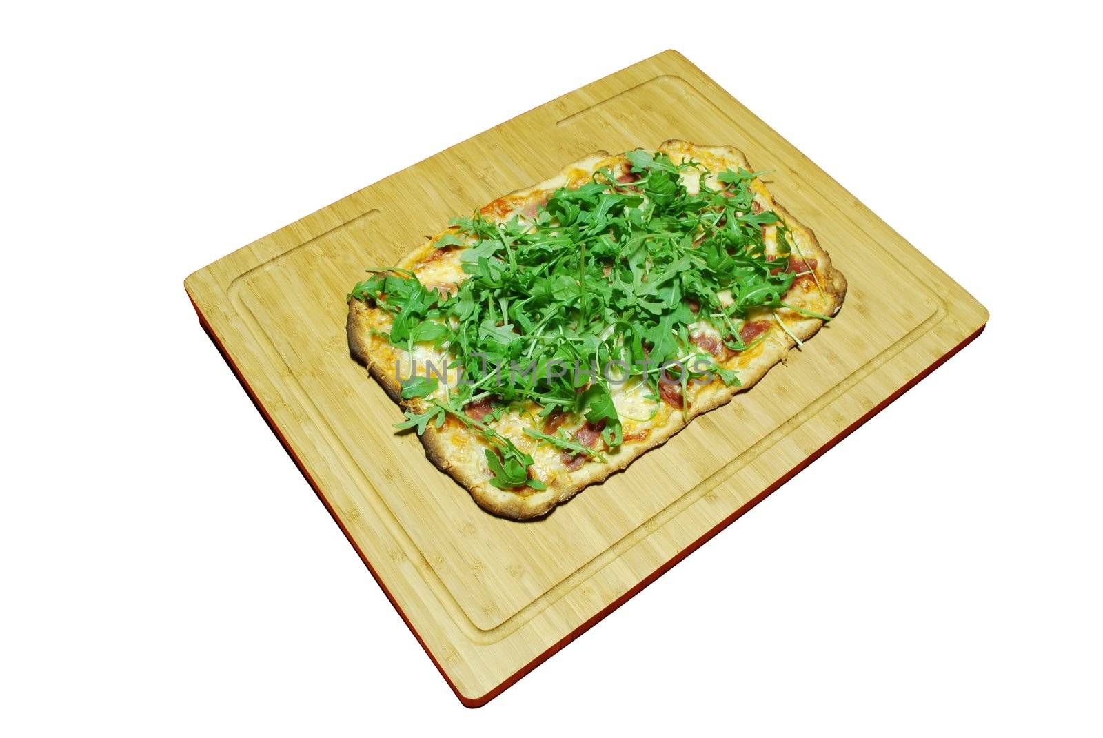 homemade pizza with 3 cheeses with prosciutto and arugula (over white) on wooden board