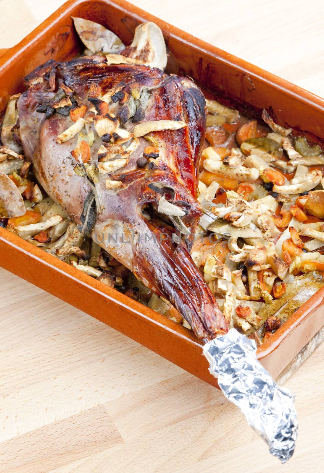 venison rump baked on vegetables with bay leaf and Jamaica pepper