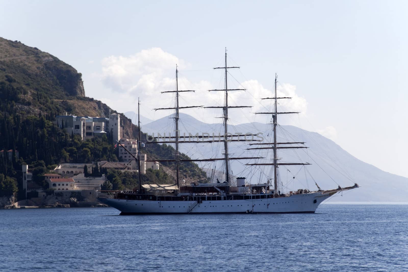 A lone pirate ship out on the blue seas