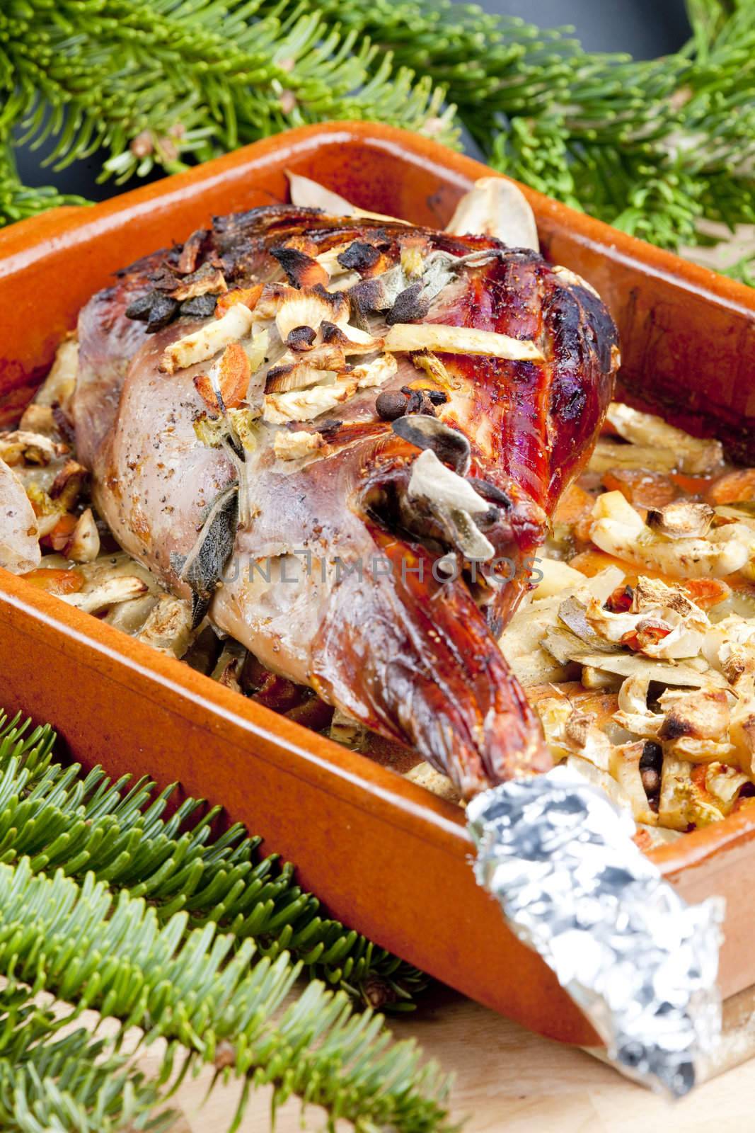 venison rump baked on vegetables with bay leaf and Jamaica pepper