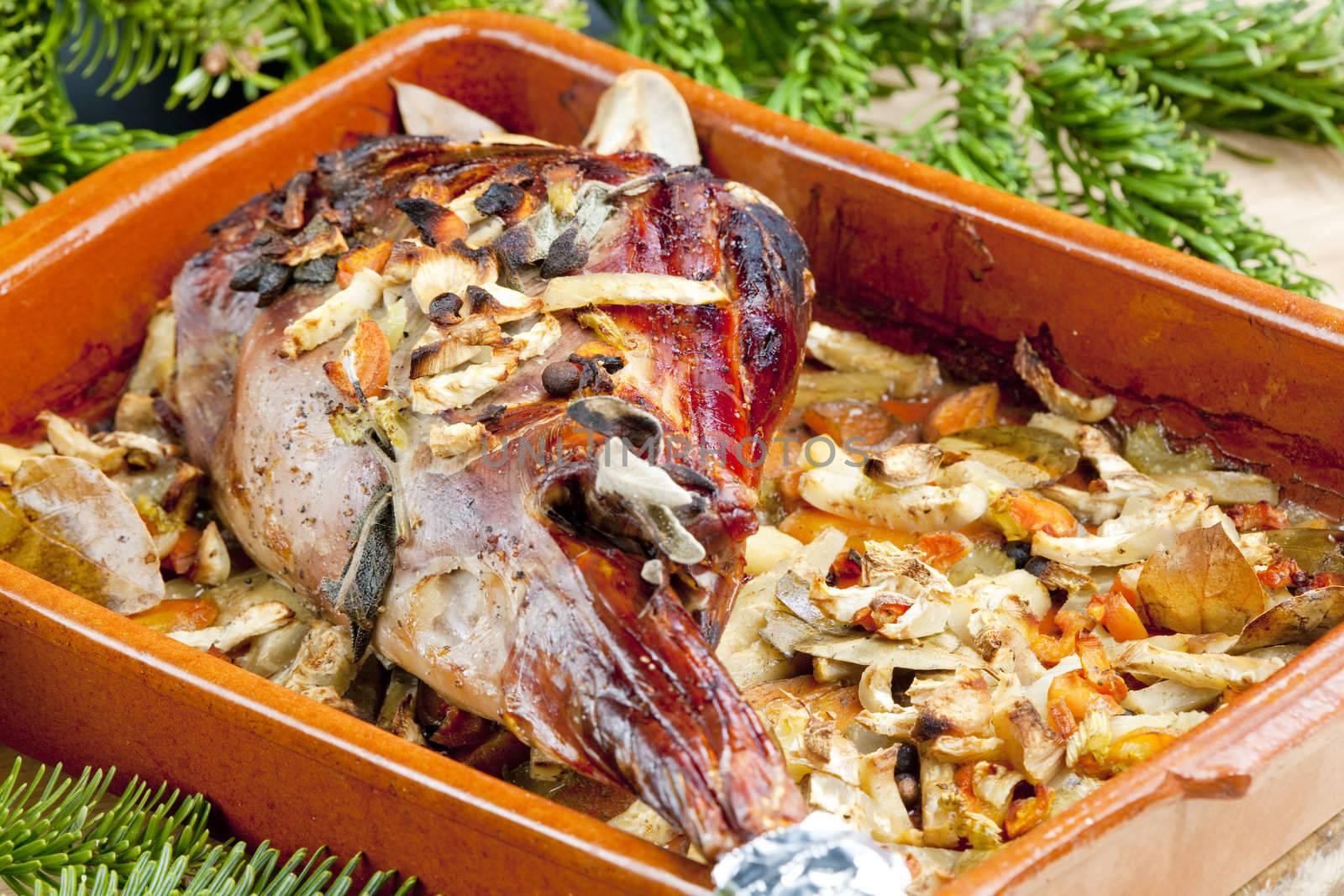 venison rump baked on vegetables with bay leaf and Jamaica pepper