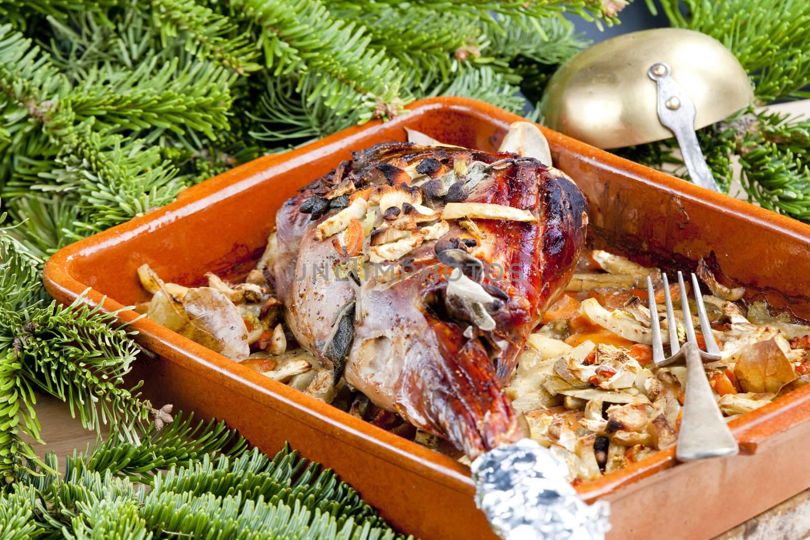 venison rump baked on vegetables with bay leaf and Jamaica pepper
