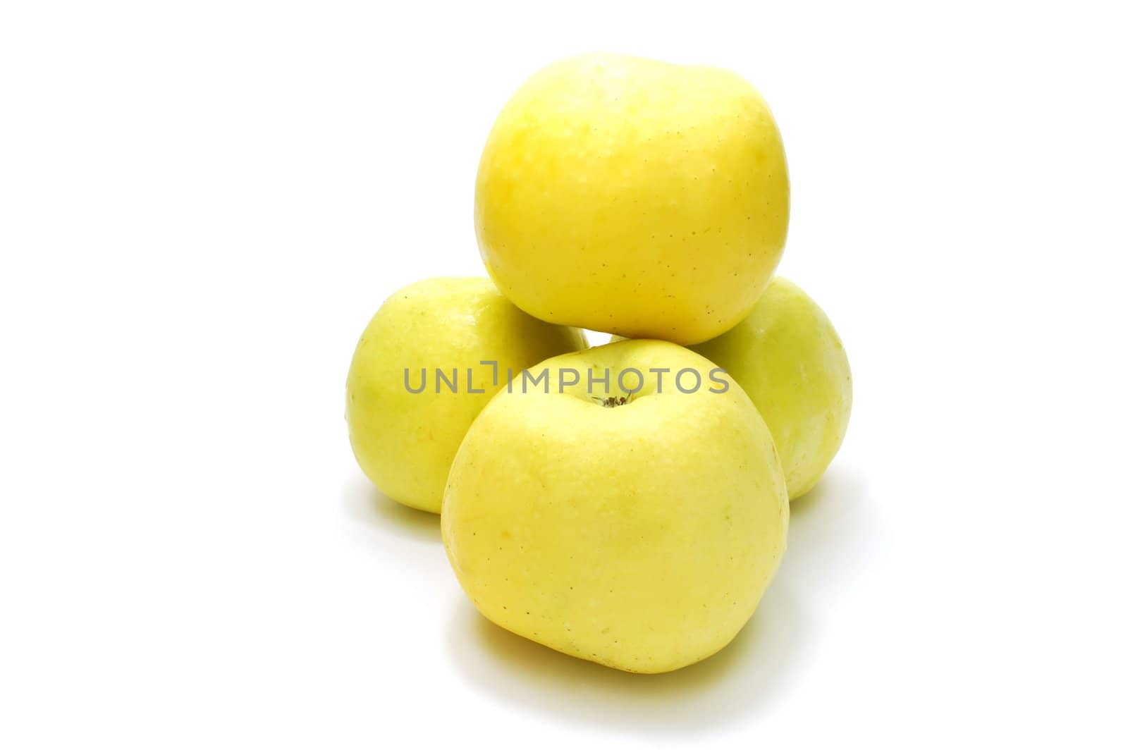 Pyramid of  Yellow Apples Isolated on White Background