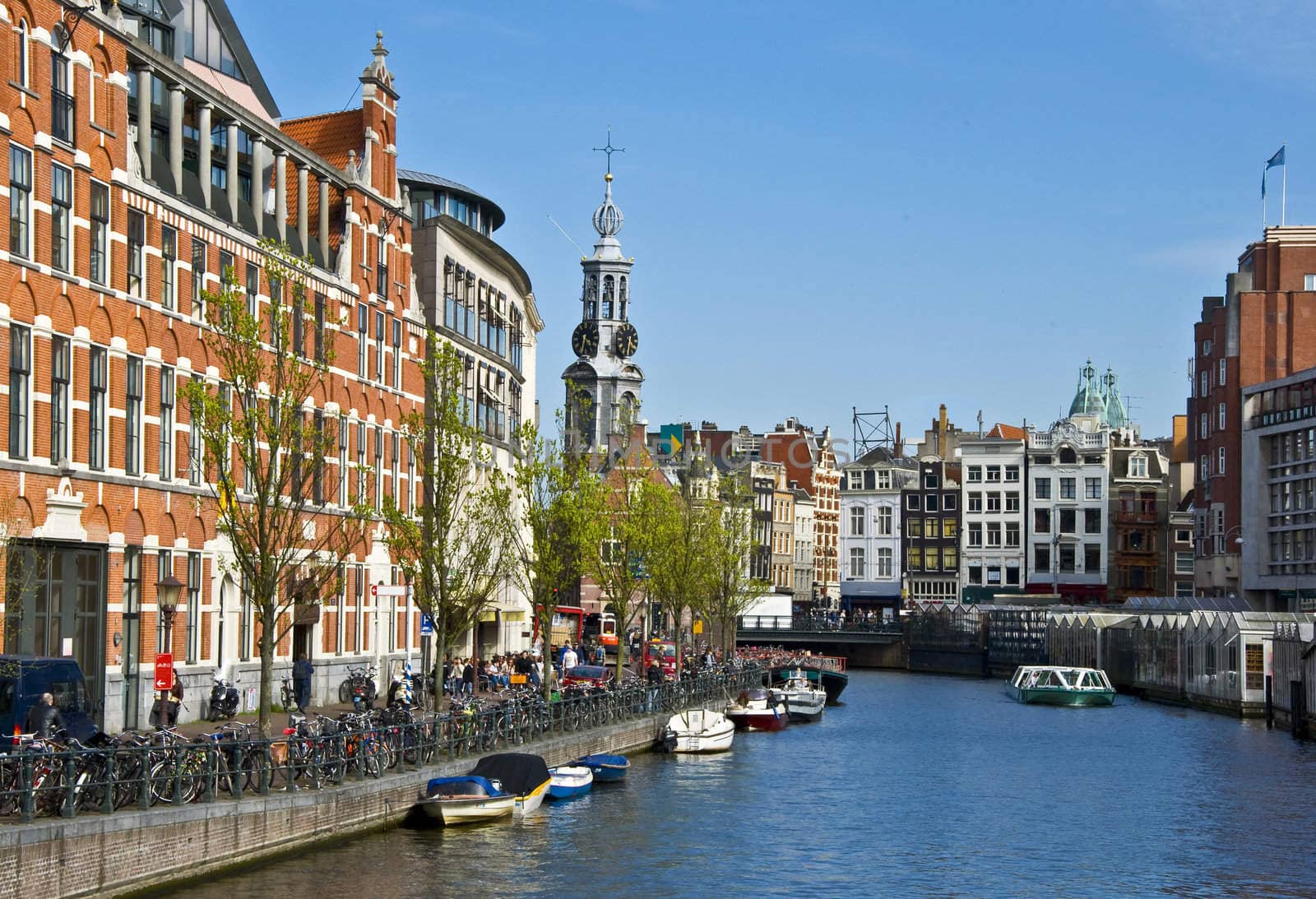 Channels in Amsterdam. Typical Amsterdam architecture. Floating Flower Market. Urban space in the spring.
