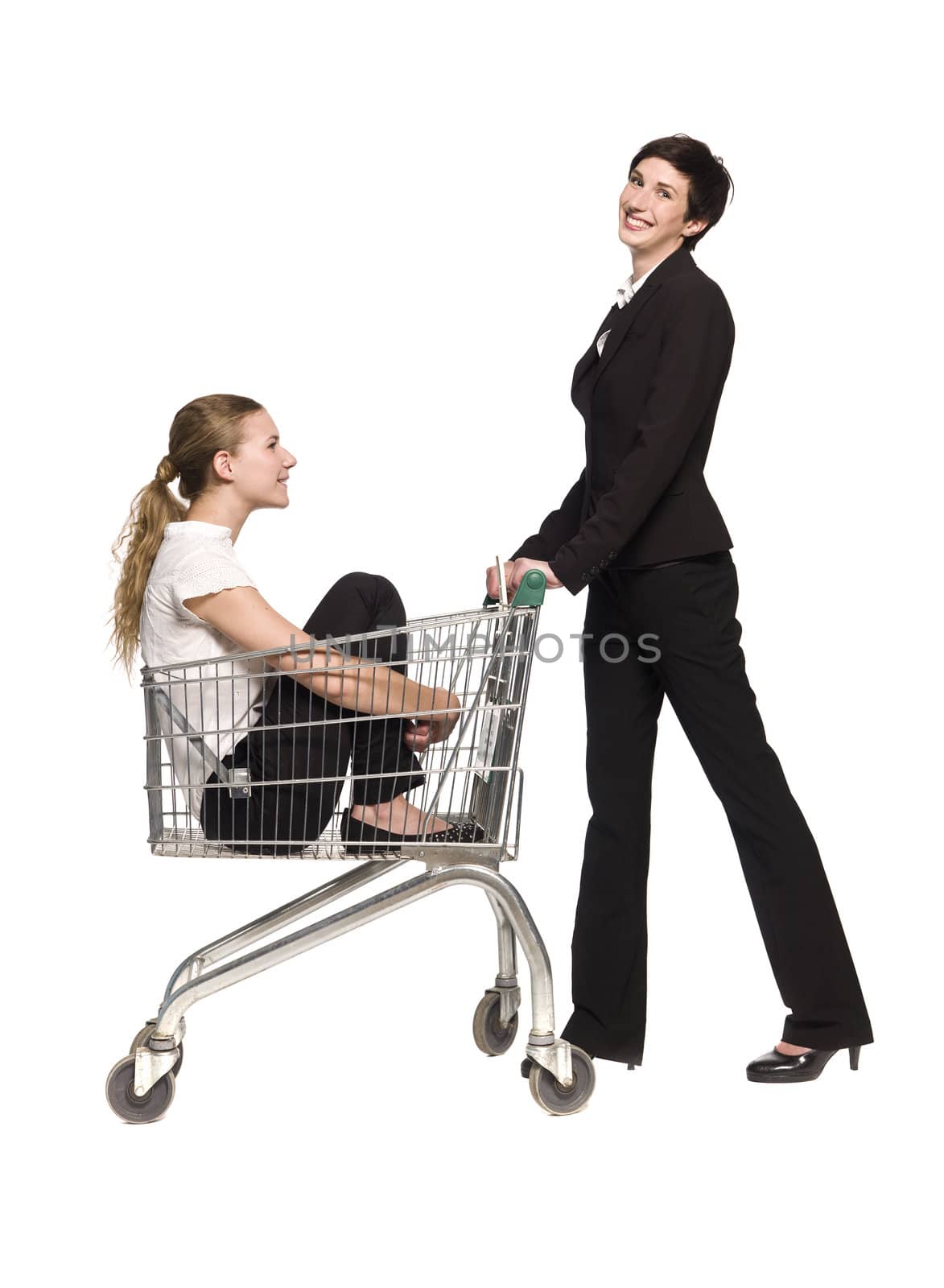 Woman with her friend in a shopping cart by gemenacom