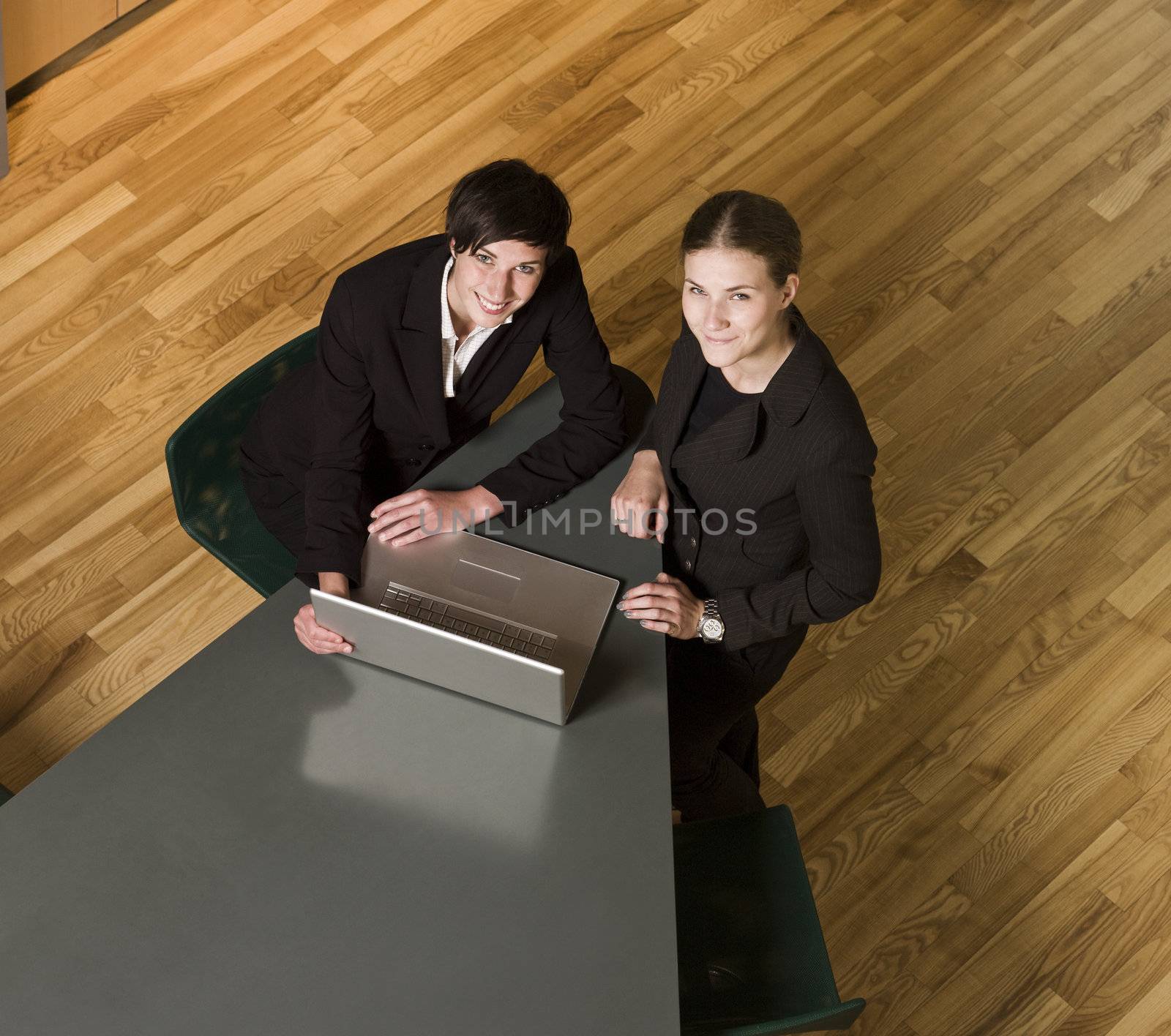 Two women from above with a computer by gemenacom