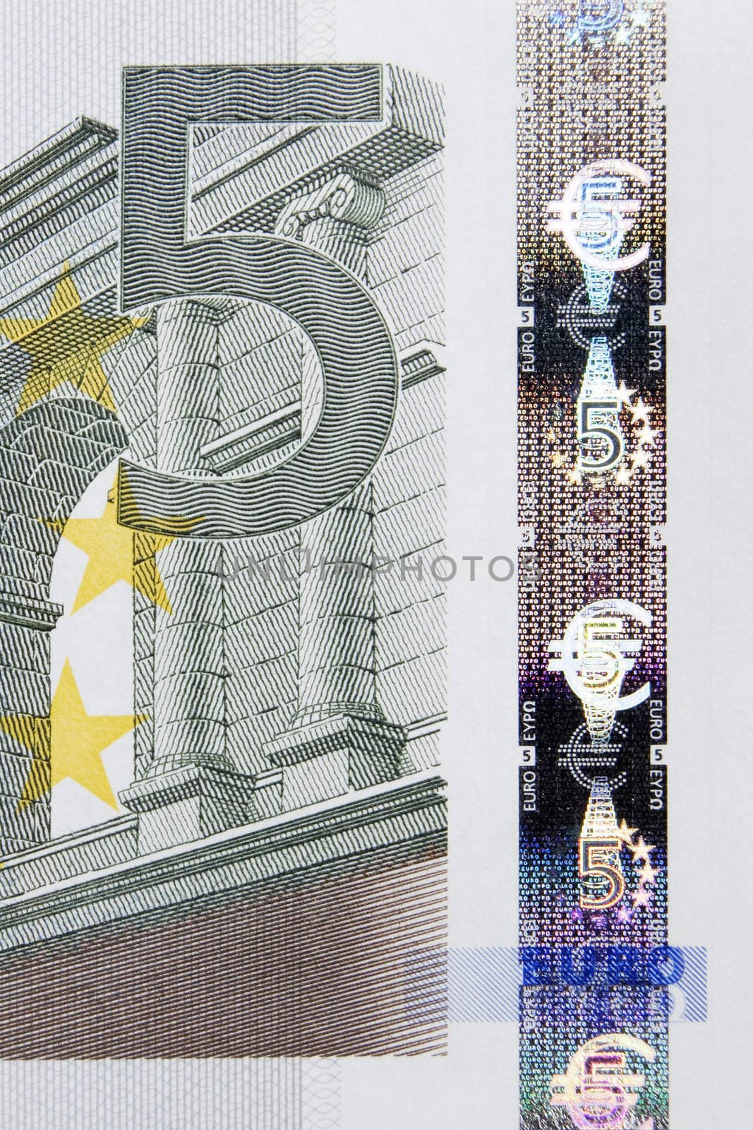Closeup photo of a part of five euro note including hologram. Macro photo.