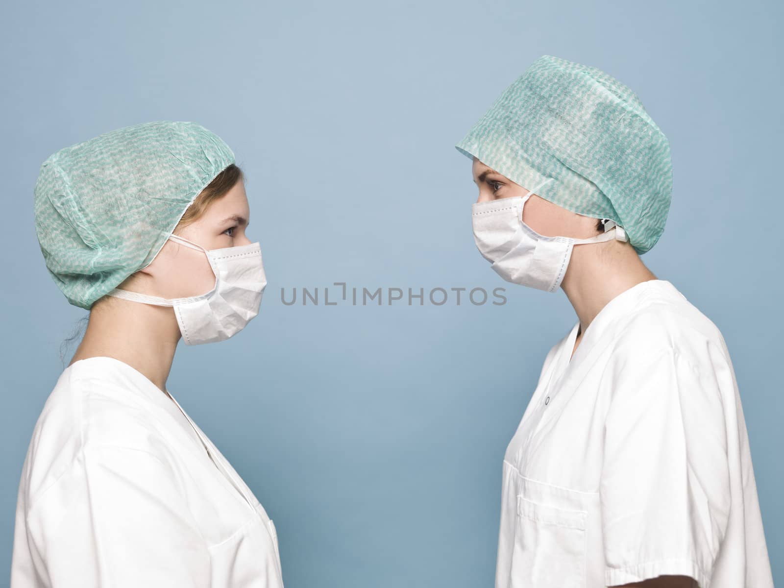 Two women with sugical masks