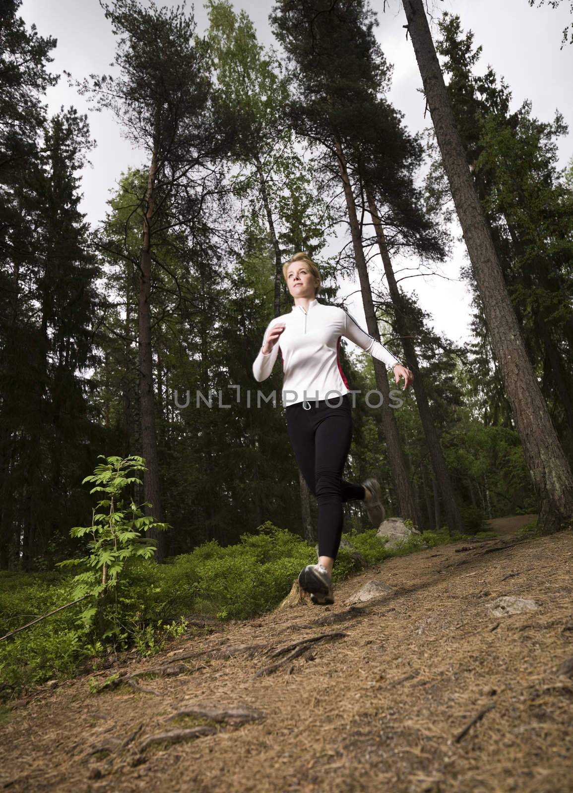 Woman running in the woods