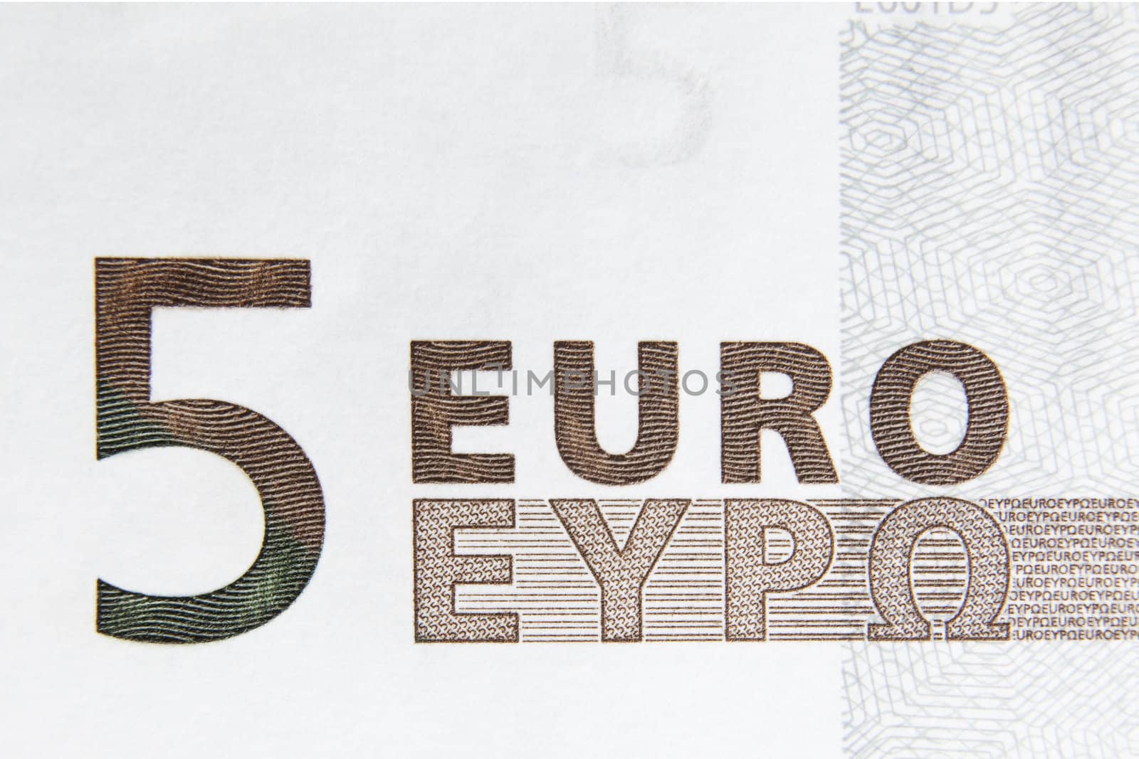 Closeup photo of a part of five euro note. Macro photo.