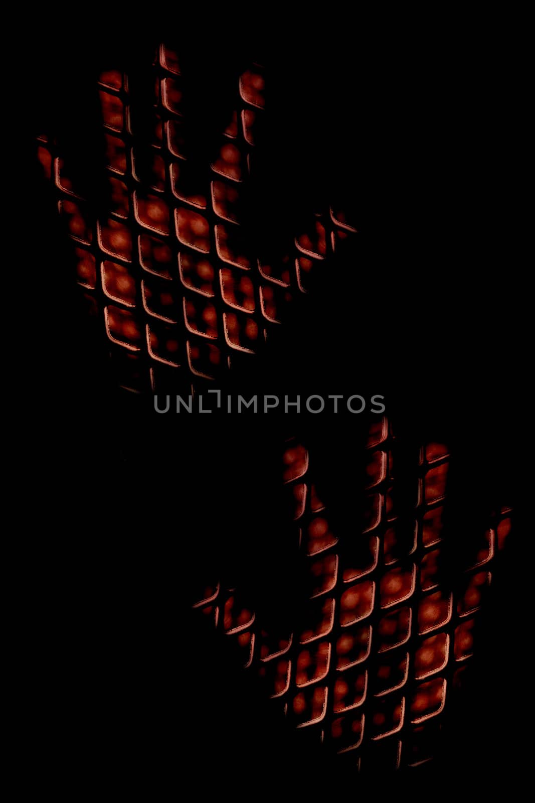 Photo manipulation: Hands behind bars.