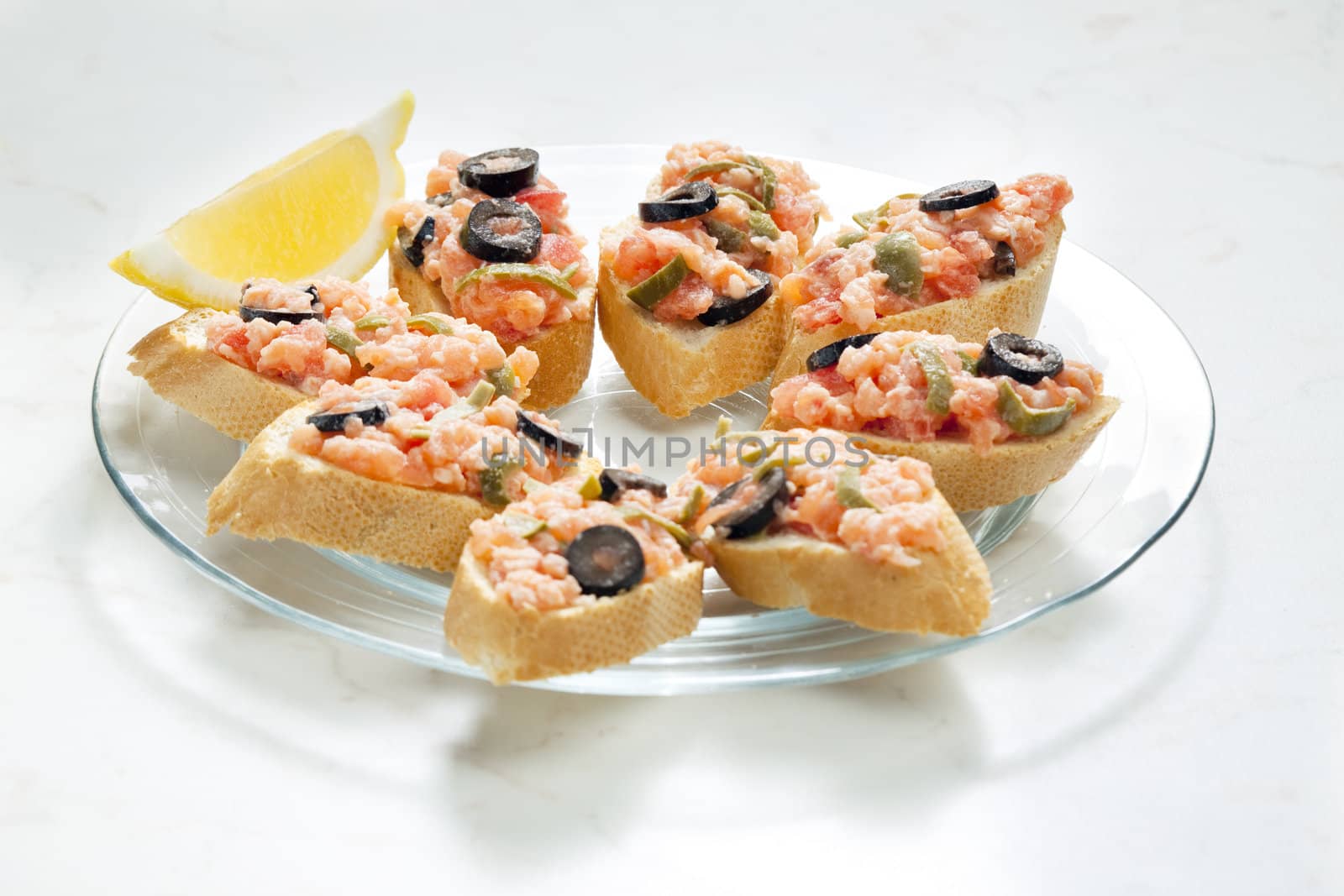 salmon tartare with capers and black olives