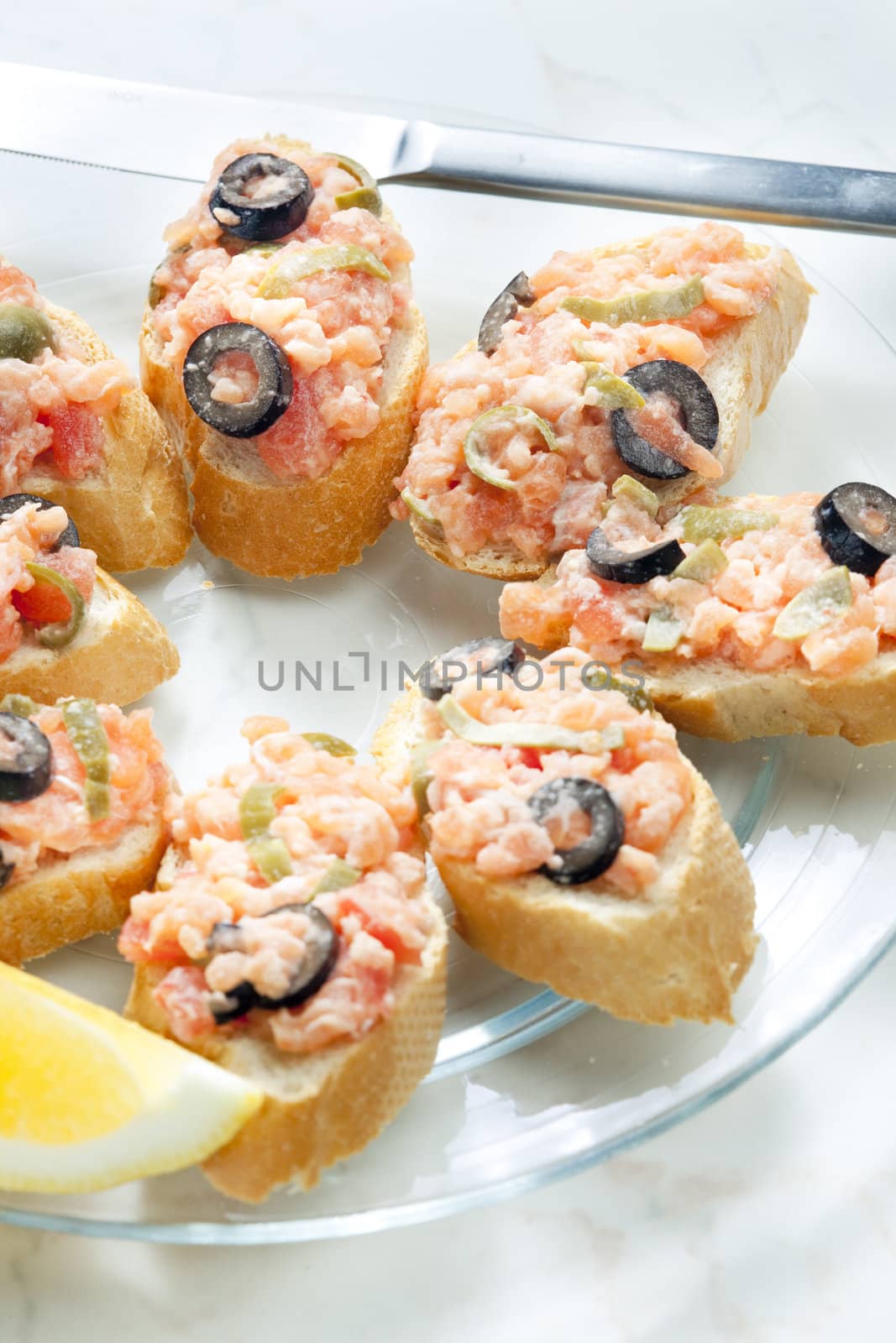 salmon tartare with capers and black olives