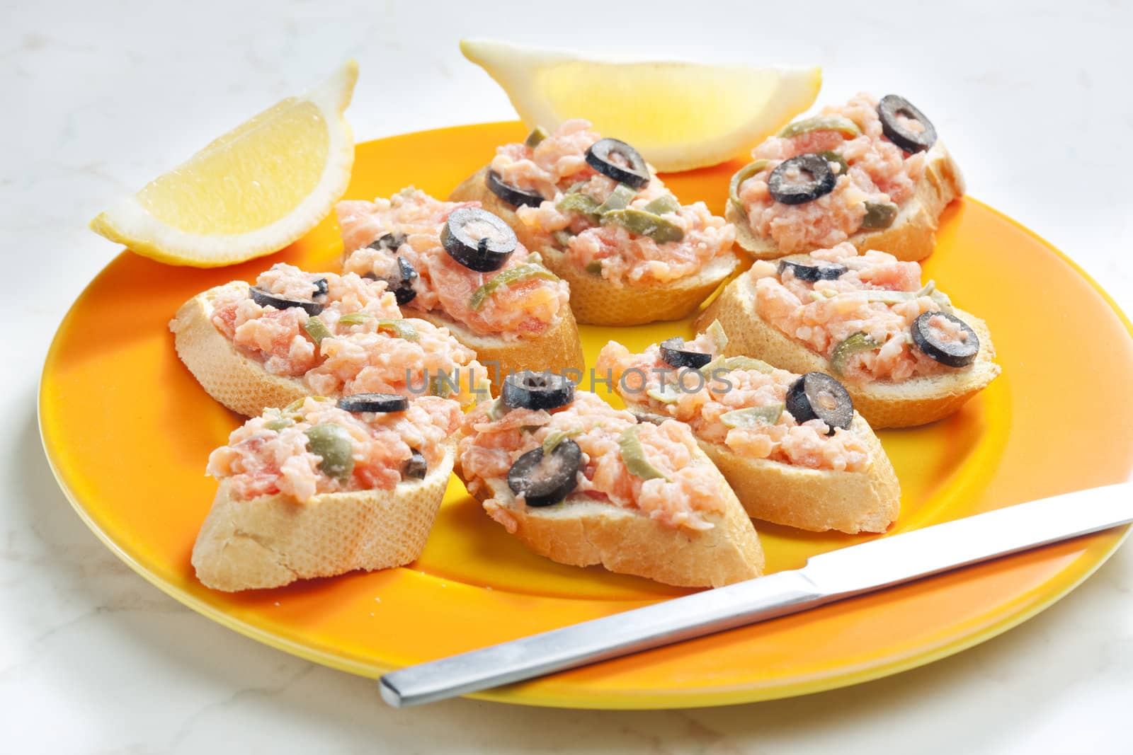 salmon tartare with capers and black olives