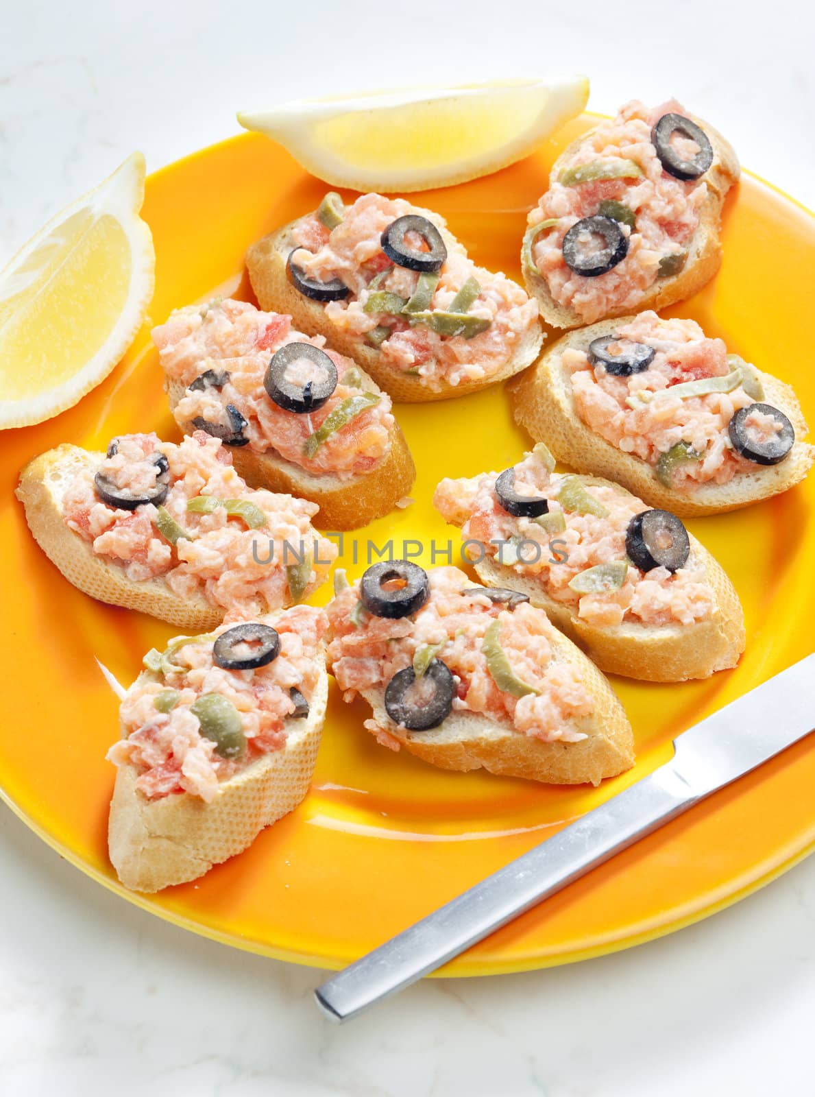 salmon tartare with capers and black olives