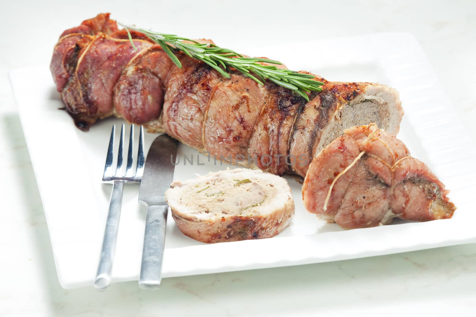veal roll filled with minced beef meat and herbs