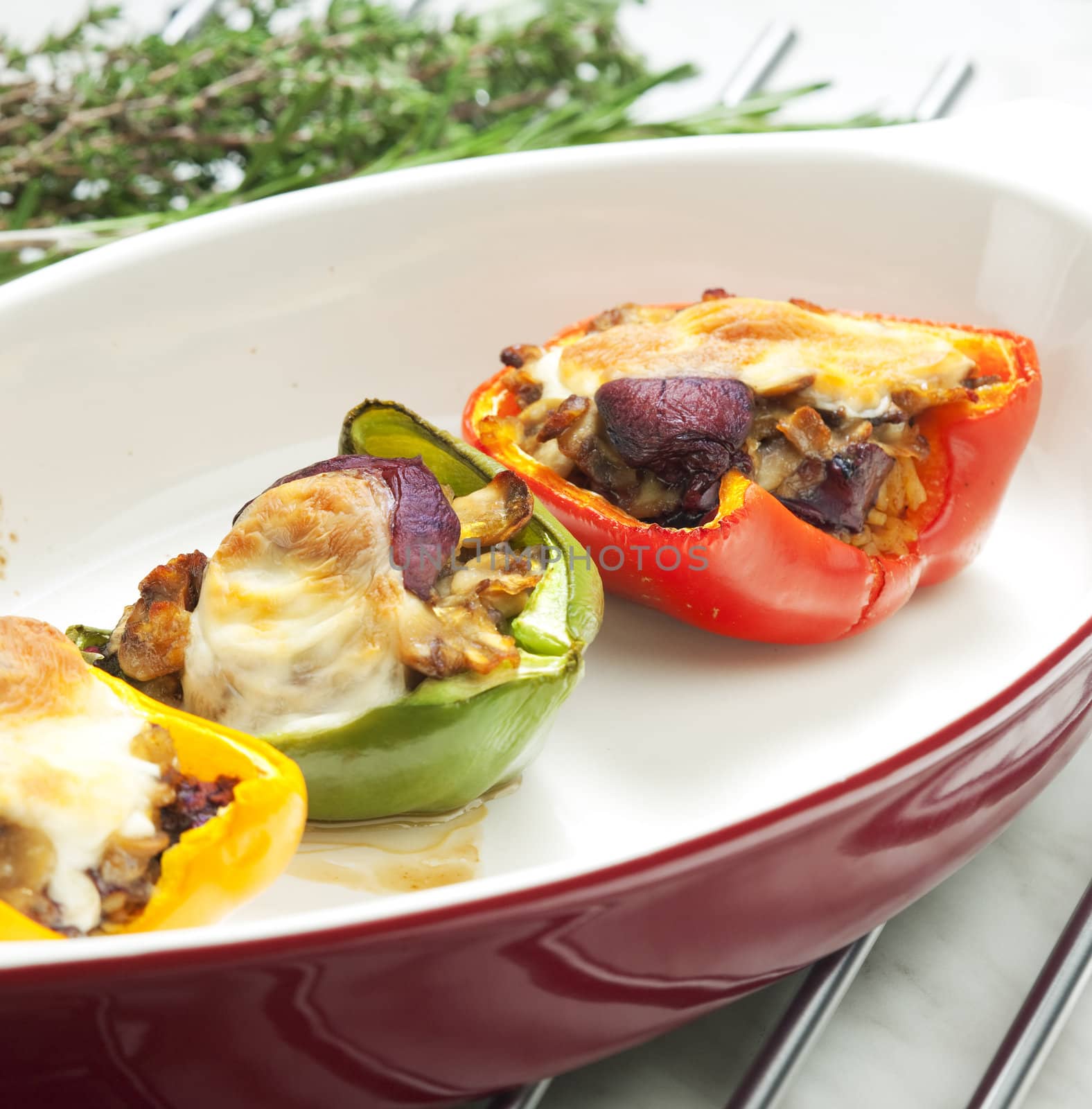 peppers filled with champignons and chicken livres baked with mozzarella cheese