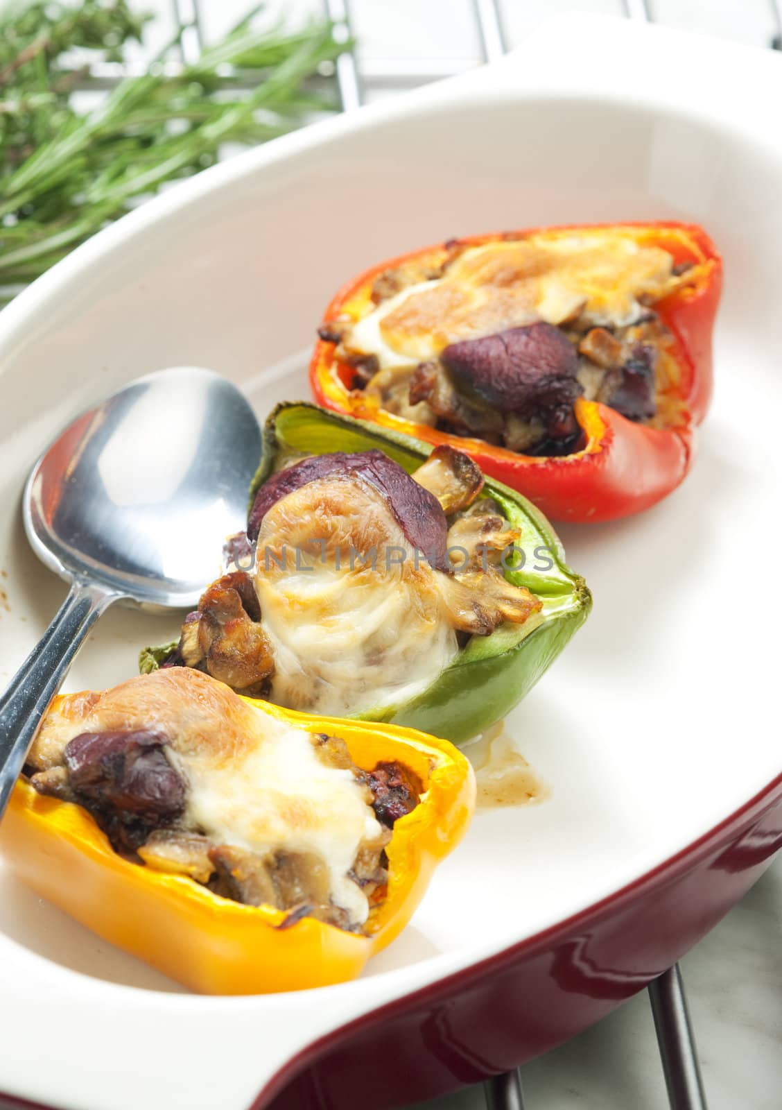 peppers filled with champignons and chicken livres baked with mozzarella cheese