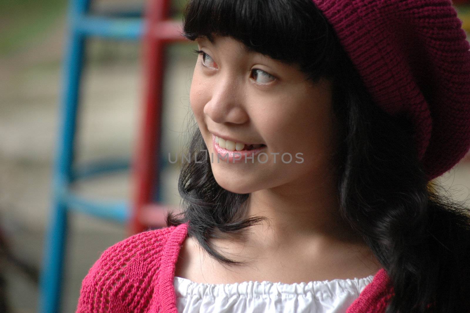 cute asian girl wearing pink hat