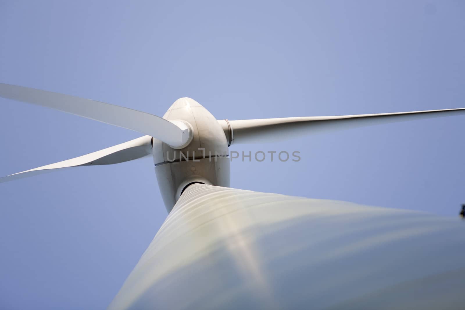 Modern windmill producing renewable energy ecologically.