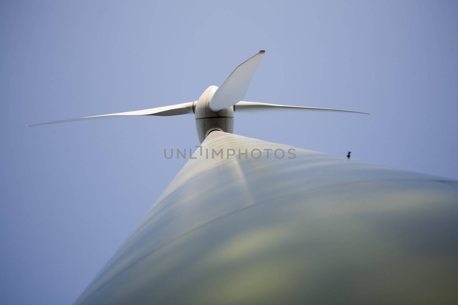 Modern windmill producing renewable energy ecologically.