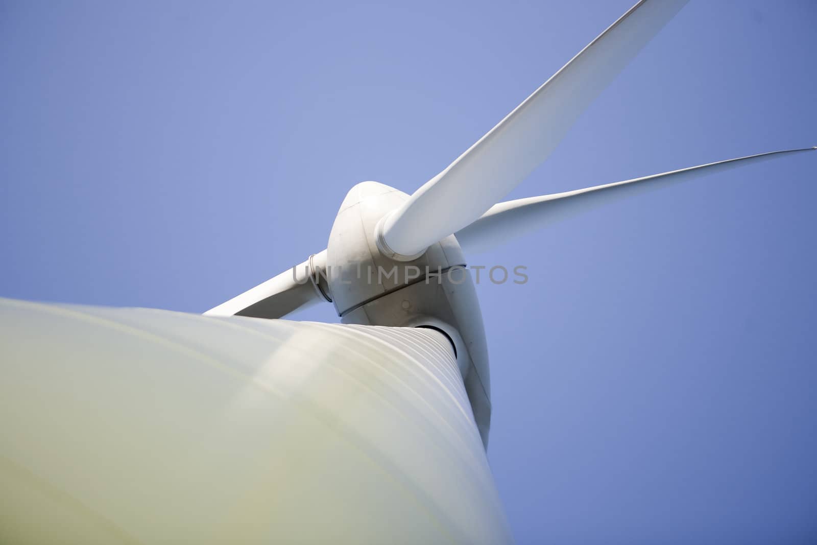 Modern windmill producing renewable energy ecologically.