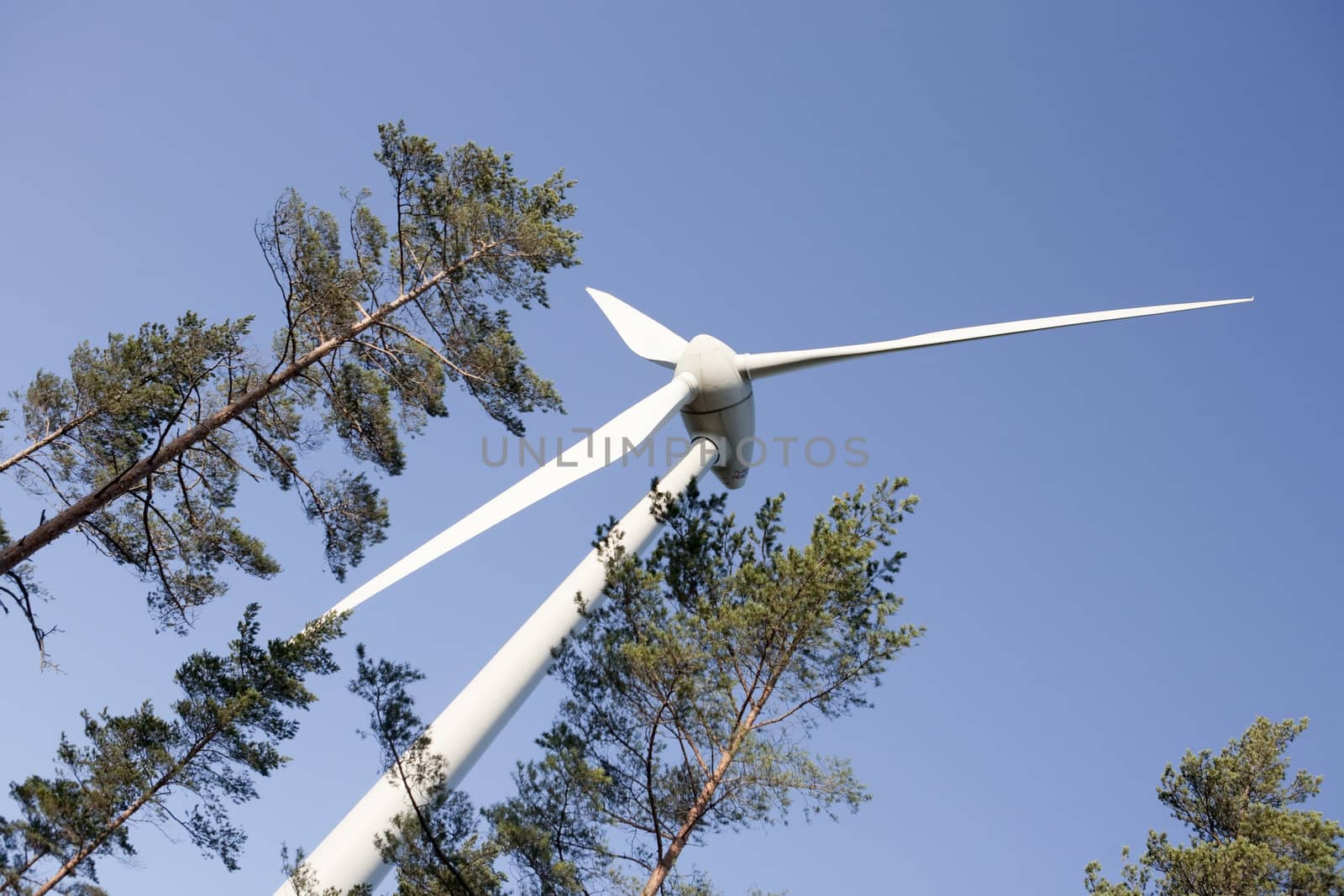 Modern windmill producing renewable energy ecologically.