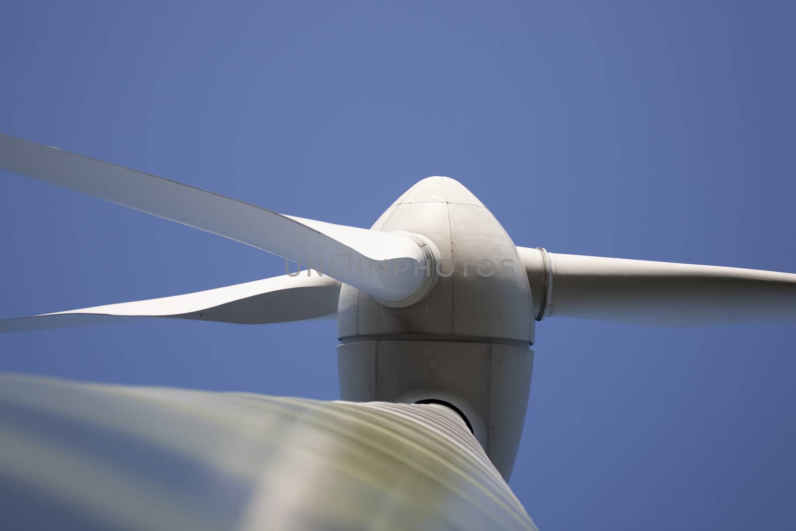 Modern windmill producing renewable energy ecologically.