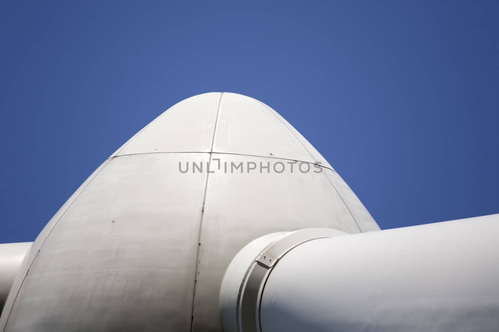Modern windmill producing renewable energy ecologically.