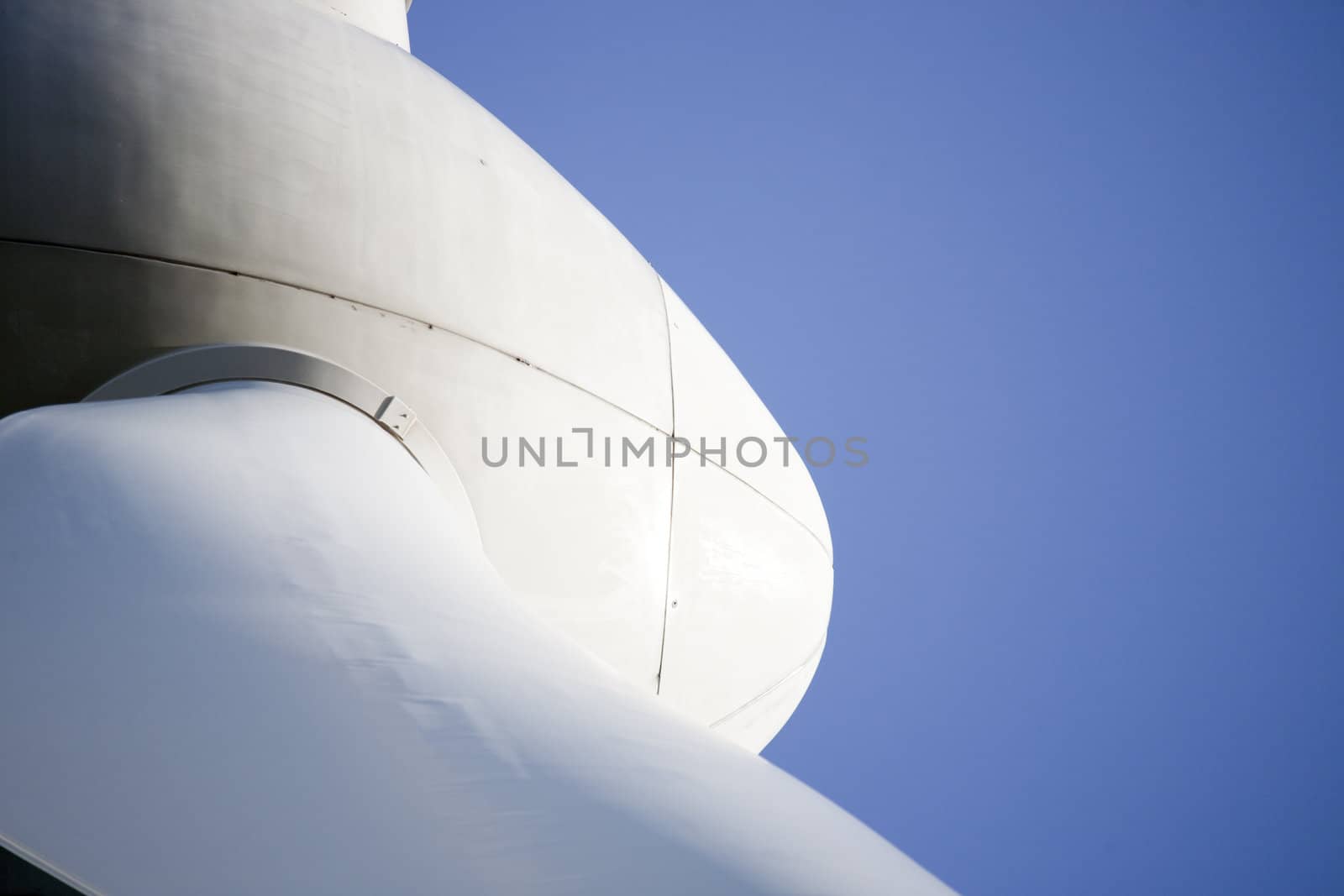 Modern windmill producing renewable energy ecologically.