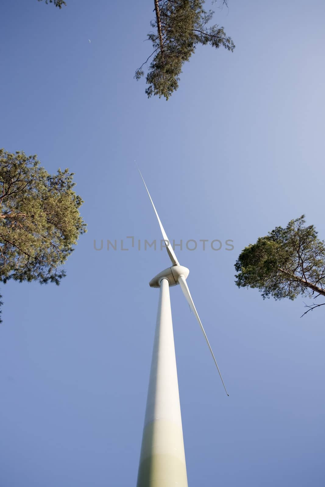 Modern windmill producing renewable energy ecologically.