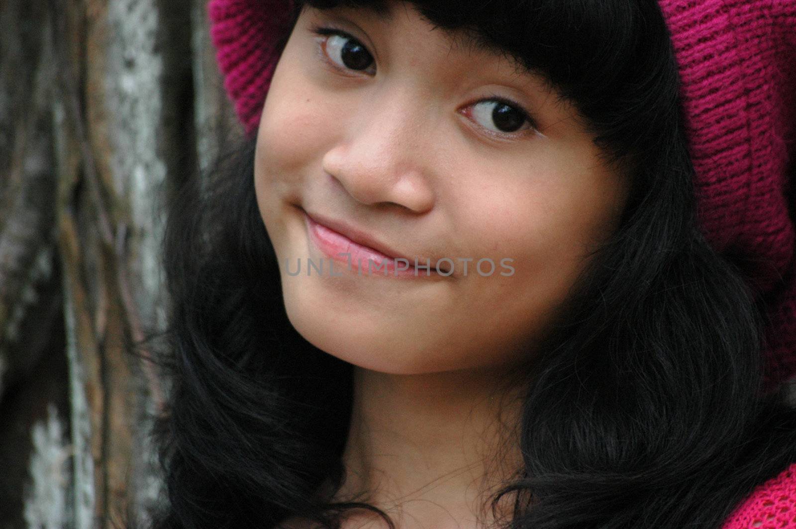 cute asian girl wearing pink hat