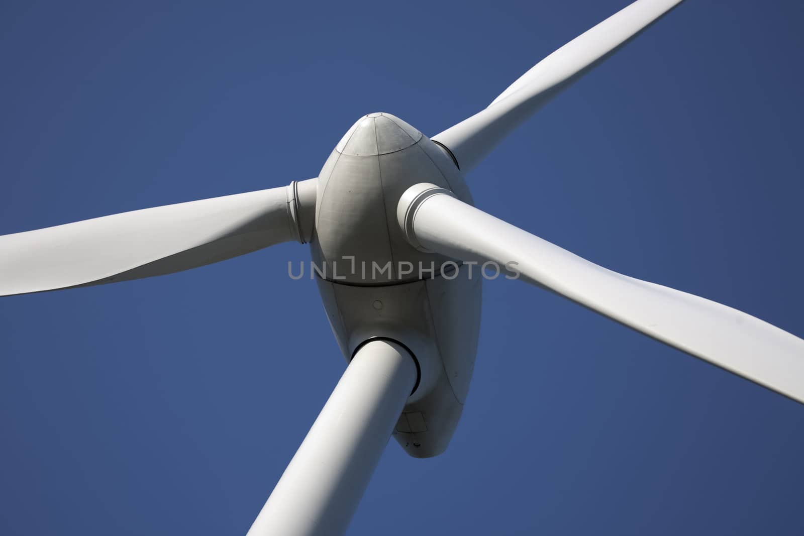 Modern windmill producing renewable energy ecologically.