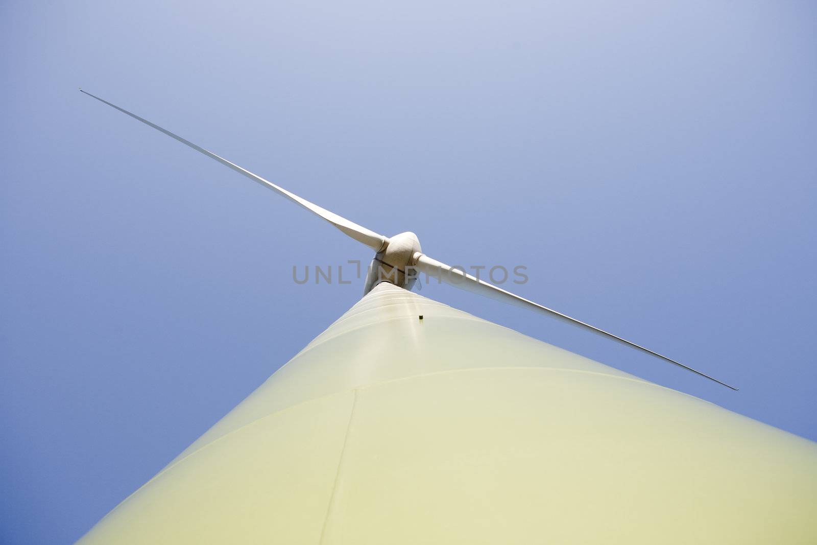 Modern windmill producing renewable energy ecologically.