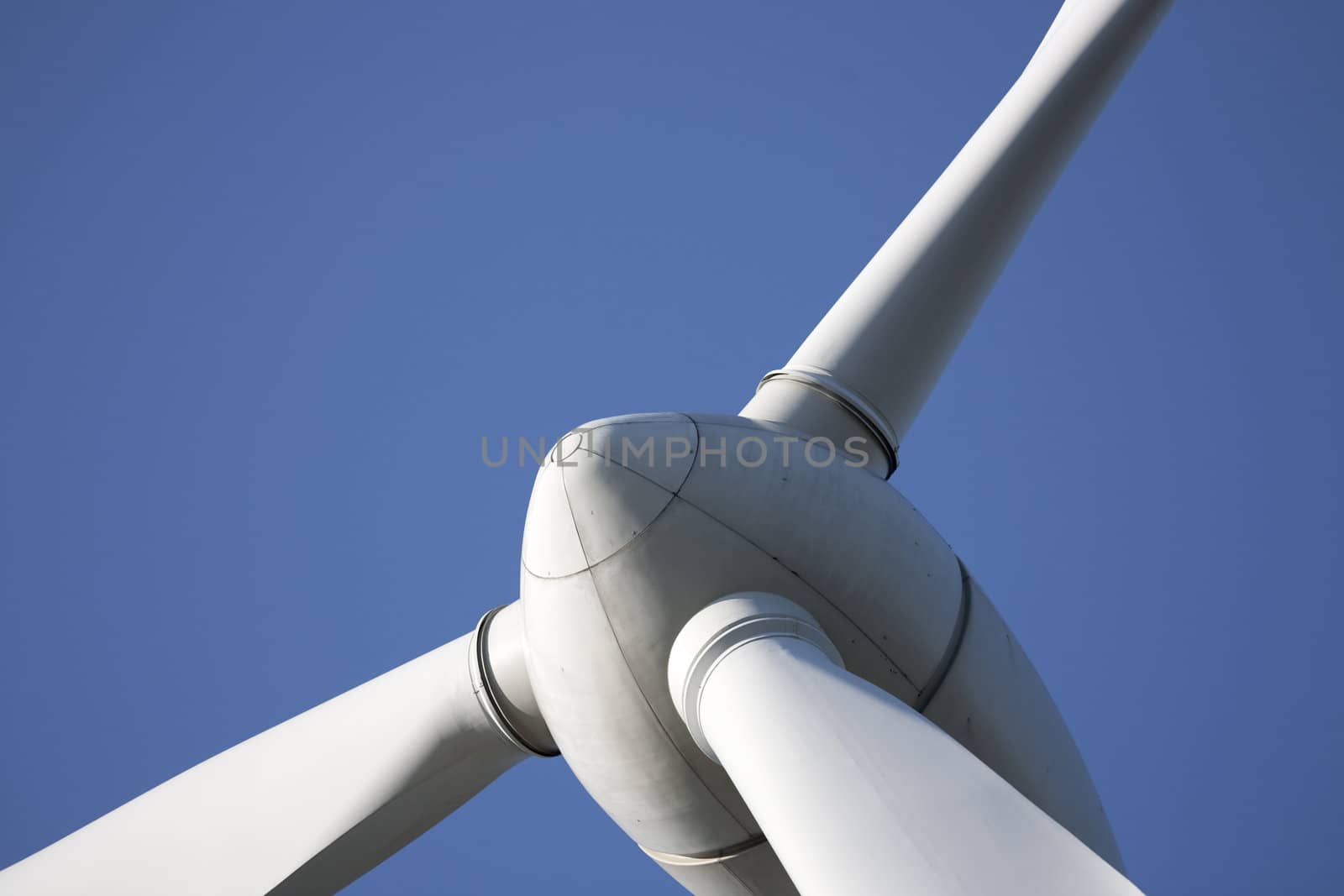 Modern windmill producing renewable energy ecologically.