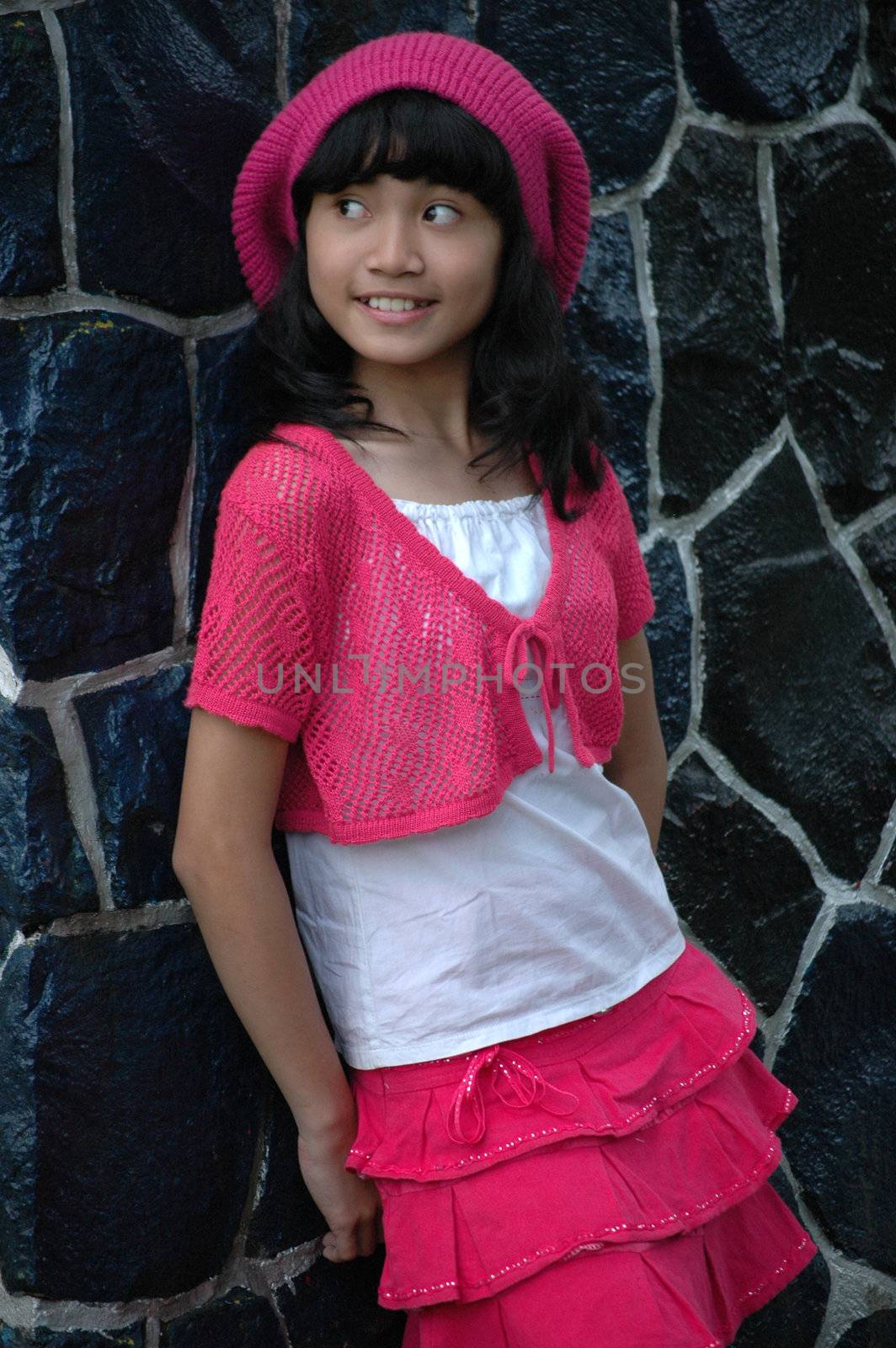 cute asian girl wearing pink hat