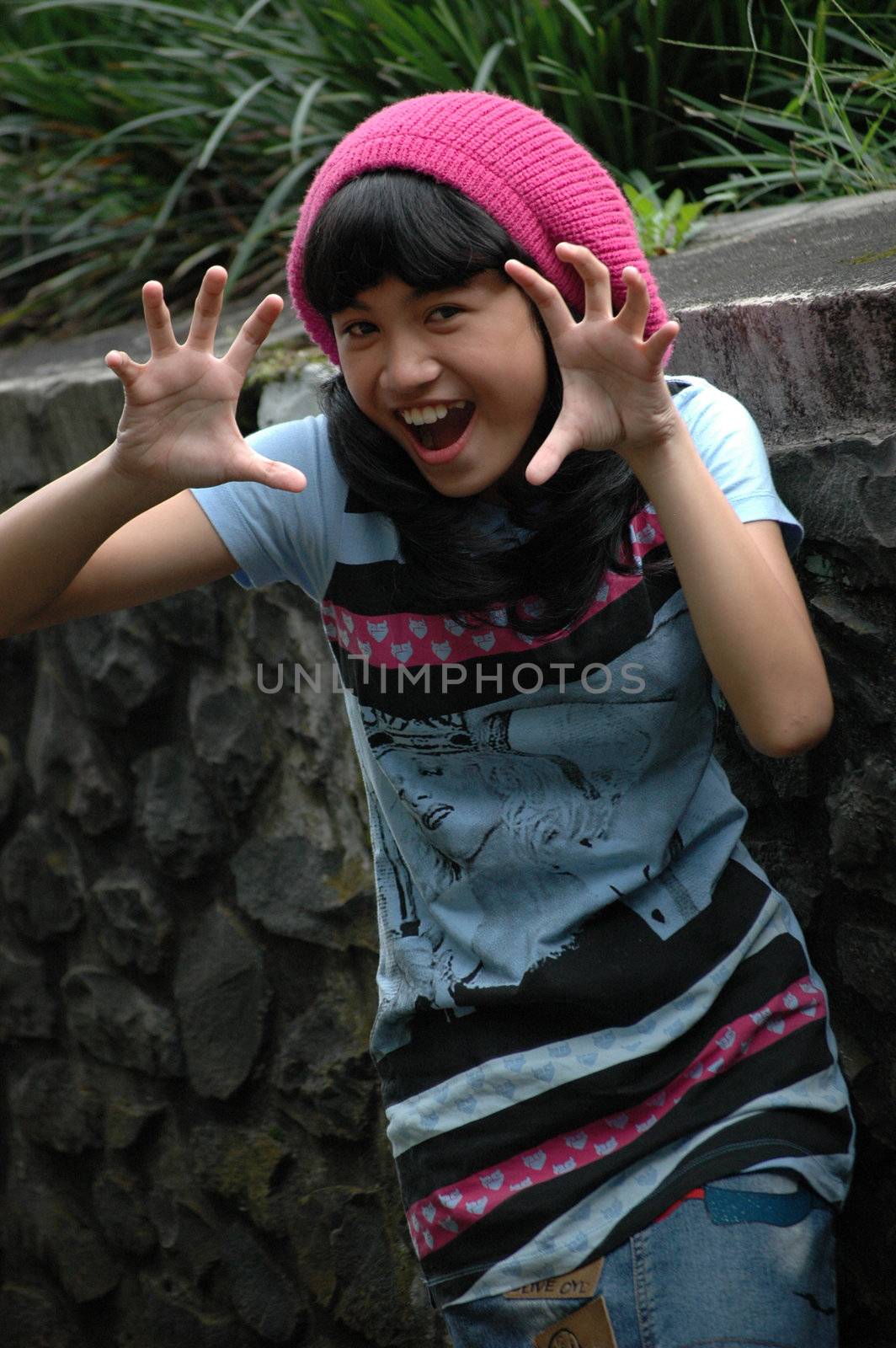 cute asian girl wearing pink hat