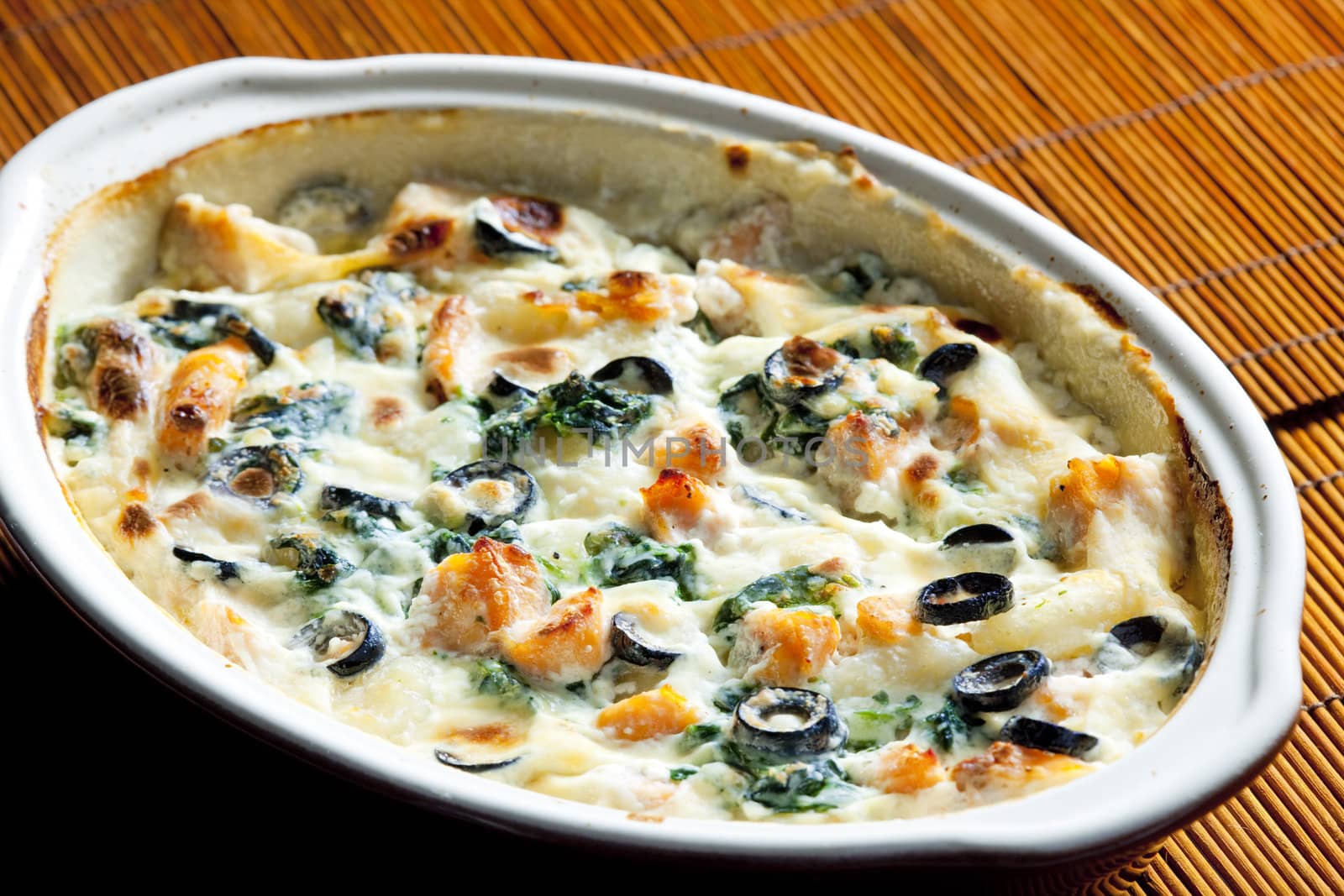 baked gnocchi with salmon, spinach and black olivves