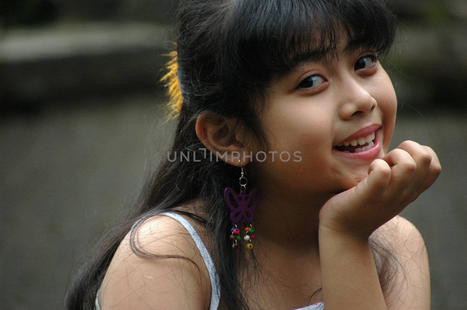 little asian girl with nice smile expression