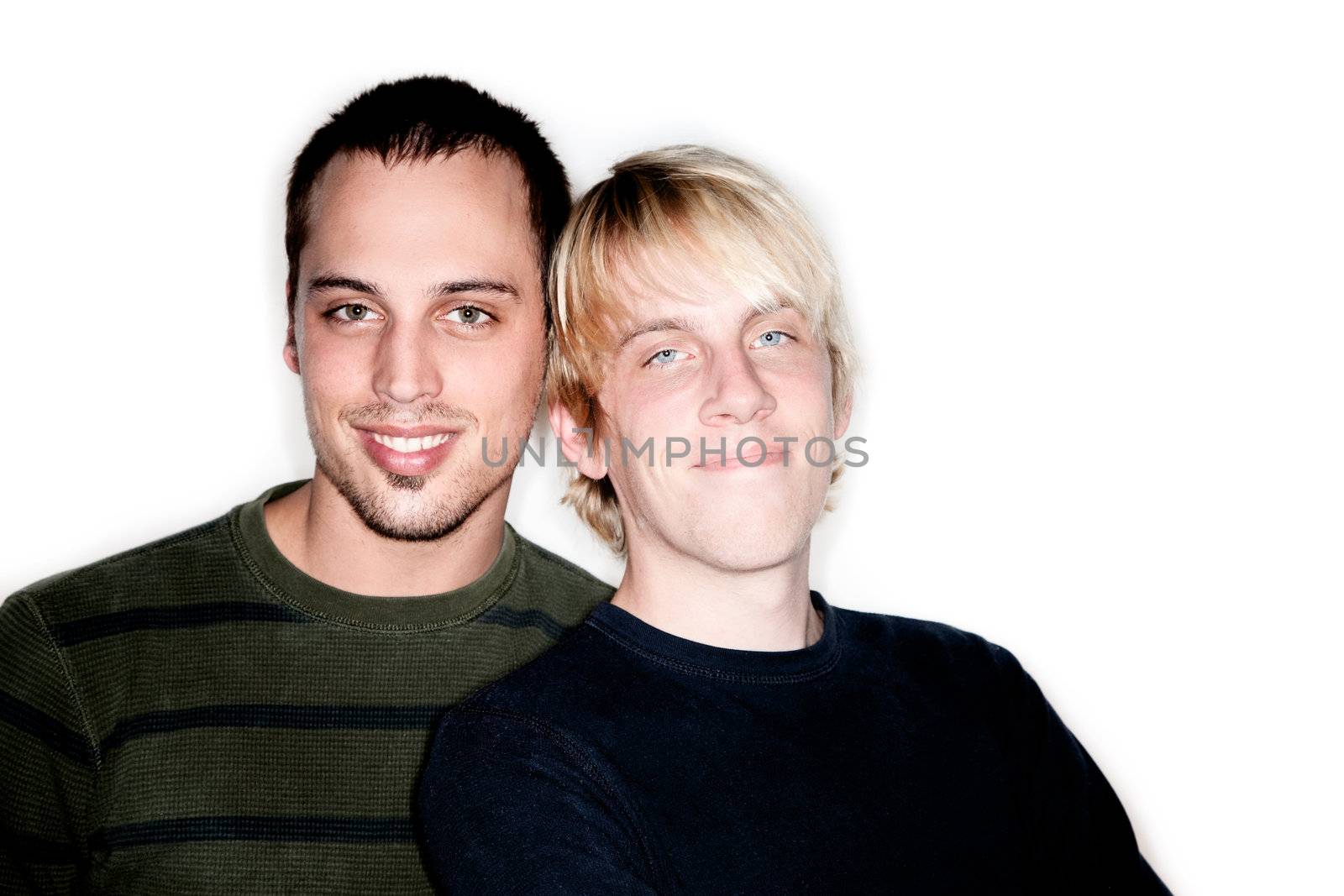 Two handsome men posing for portrait on white background