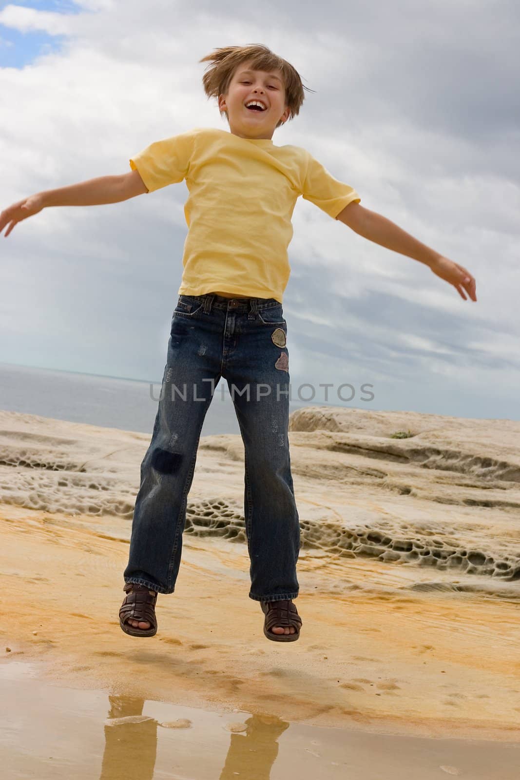 Boy jumping up and down.