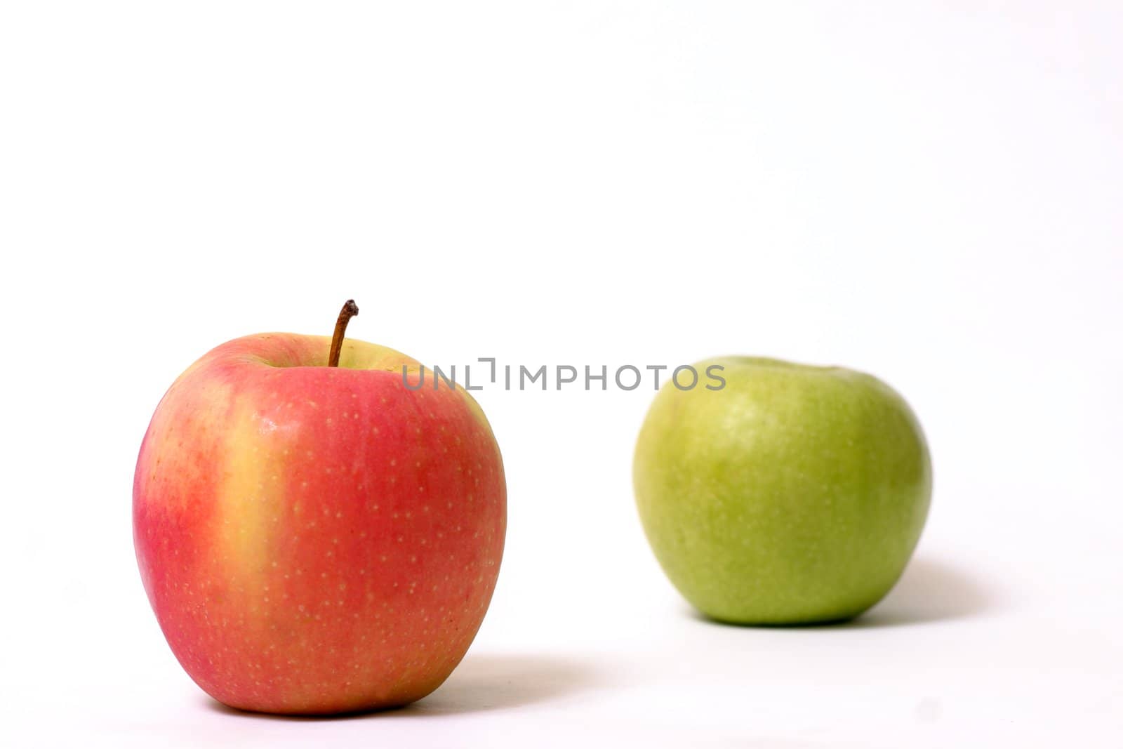 Red and green apple.  Focus is on the red apple