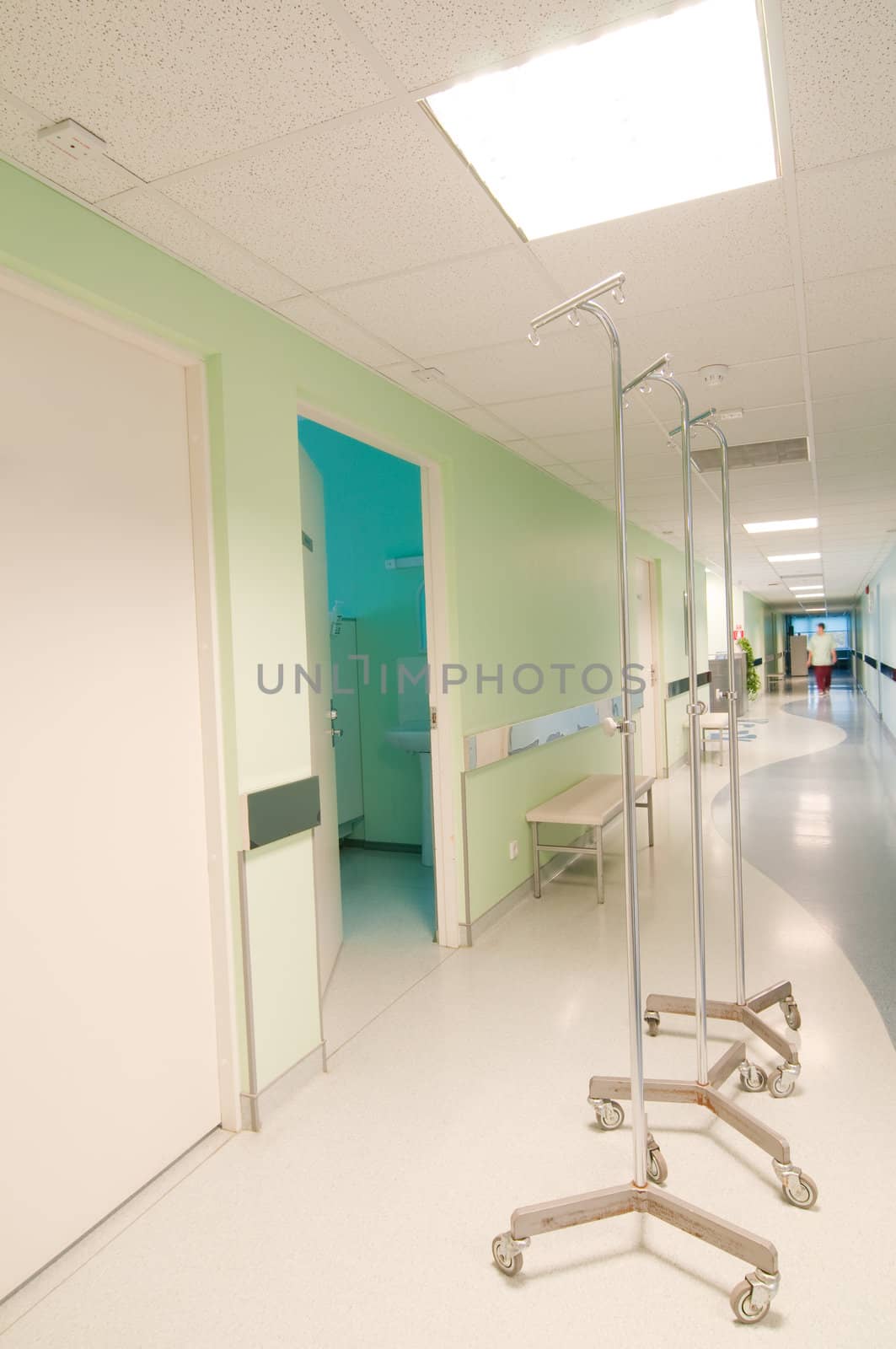 Long corridor in hospital with doors and reflections 