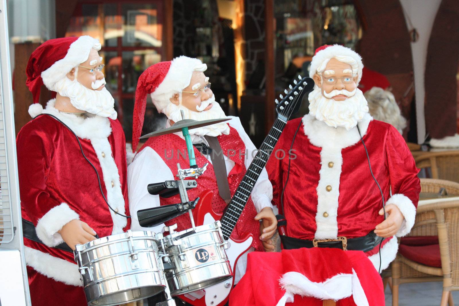 Santa Claus and friends performing as a rock band