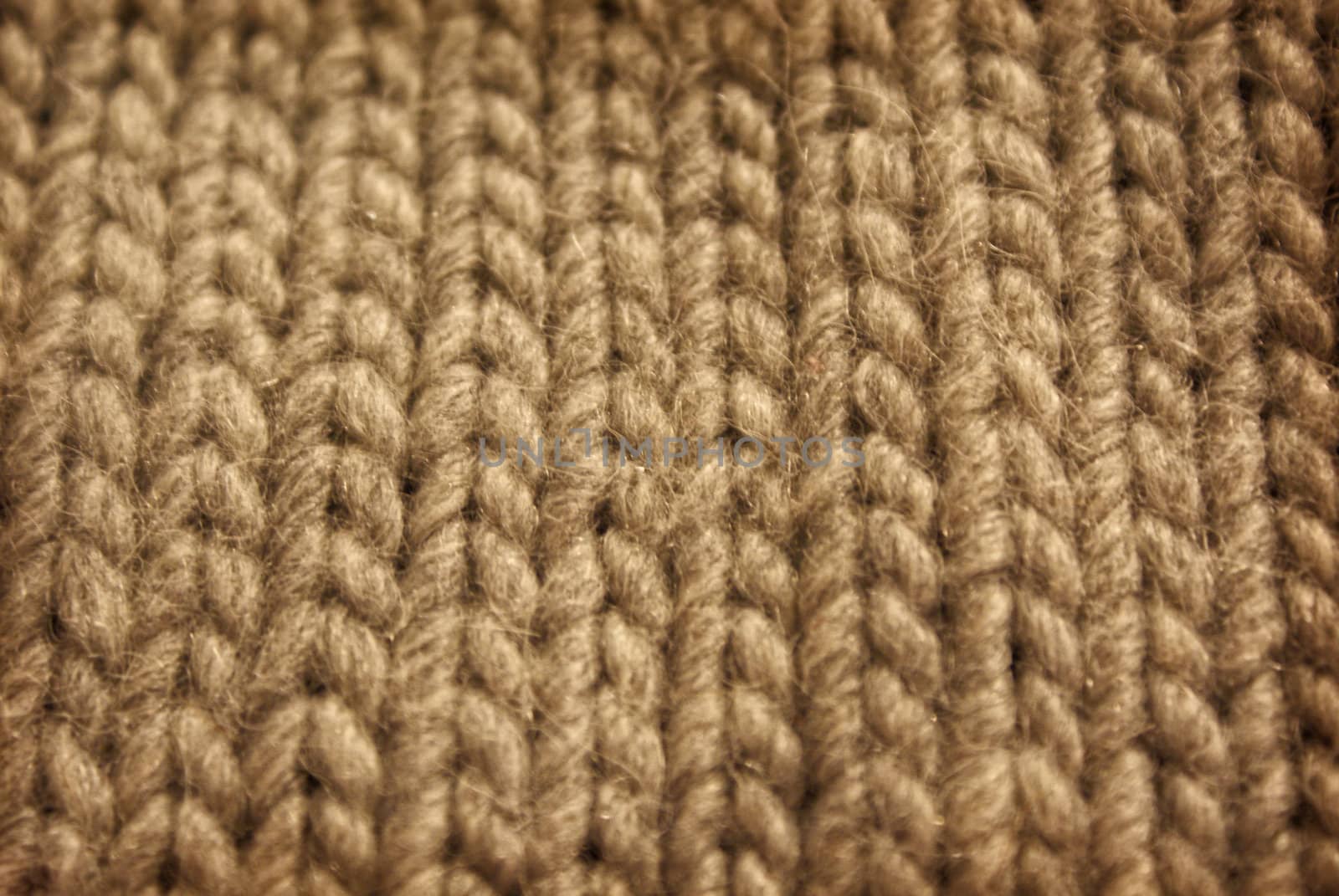 gray background of knitted wool scarf