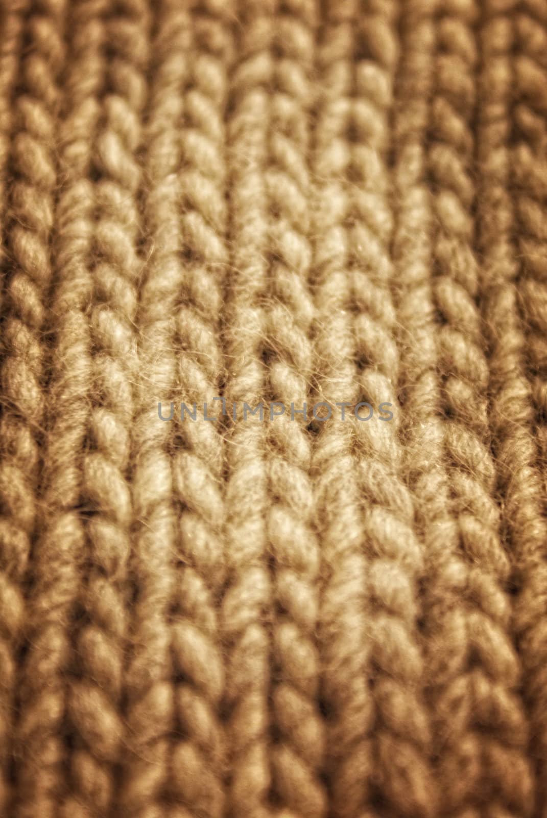 gray background of hand-knitted wool scarf